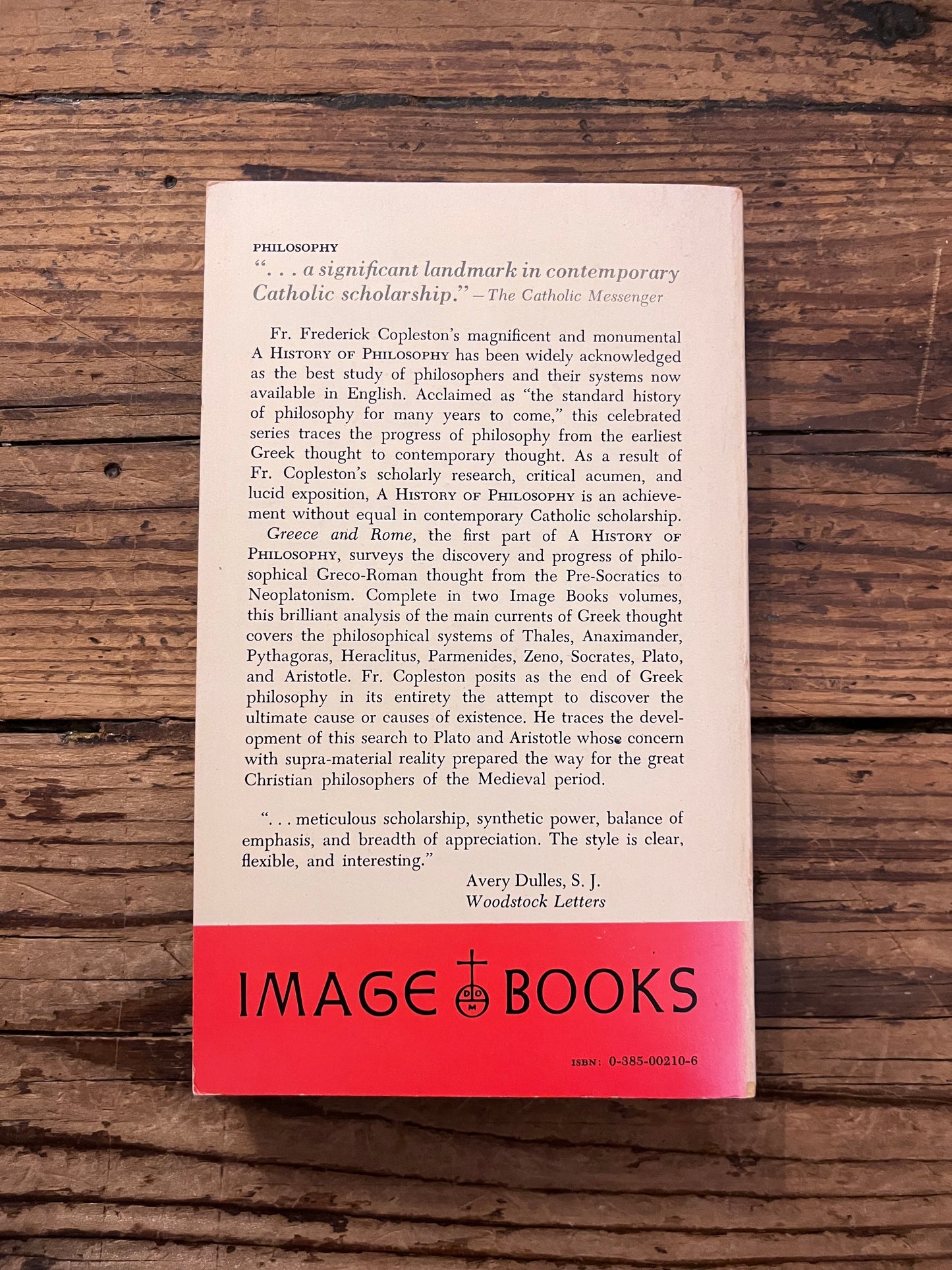 Photo of the book "a history of philosophy" on a wooden background