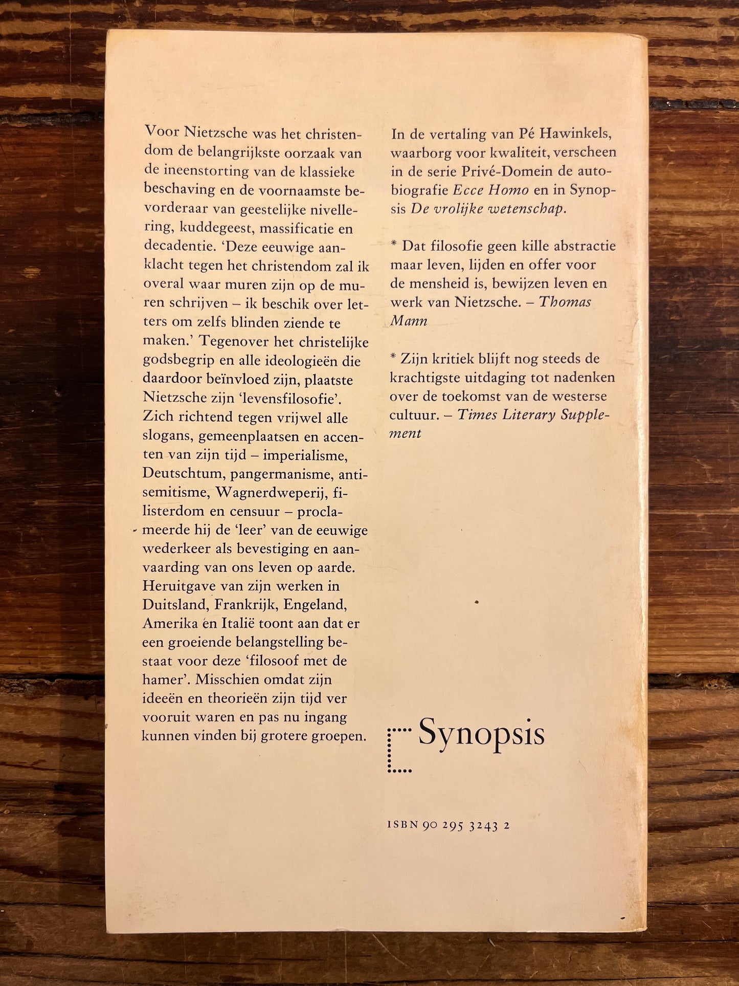 back of book with text on a wooden surface