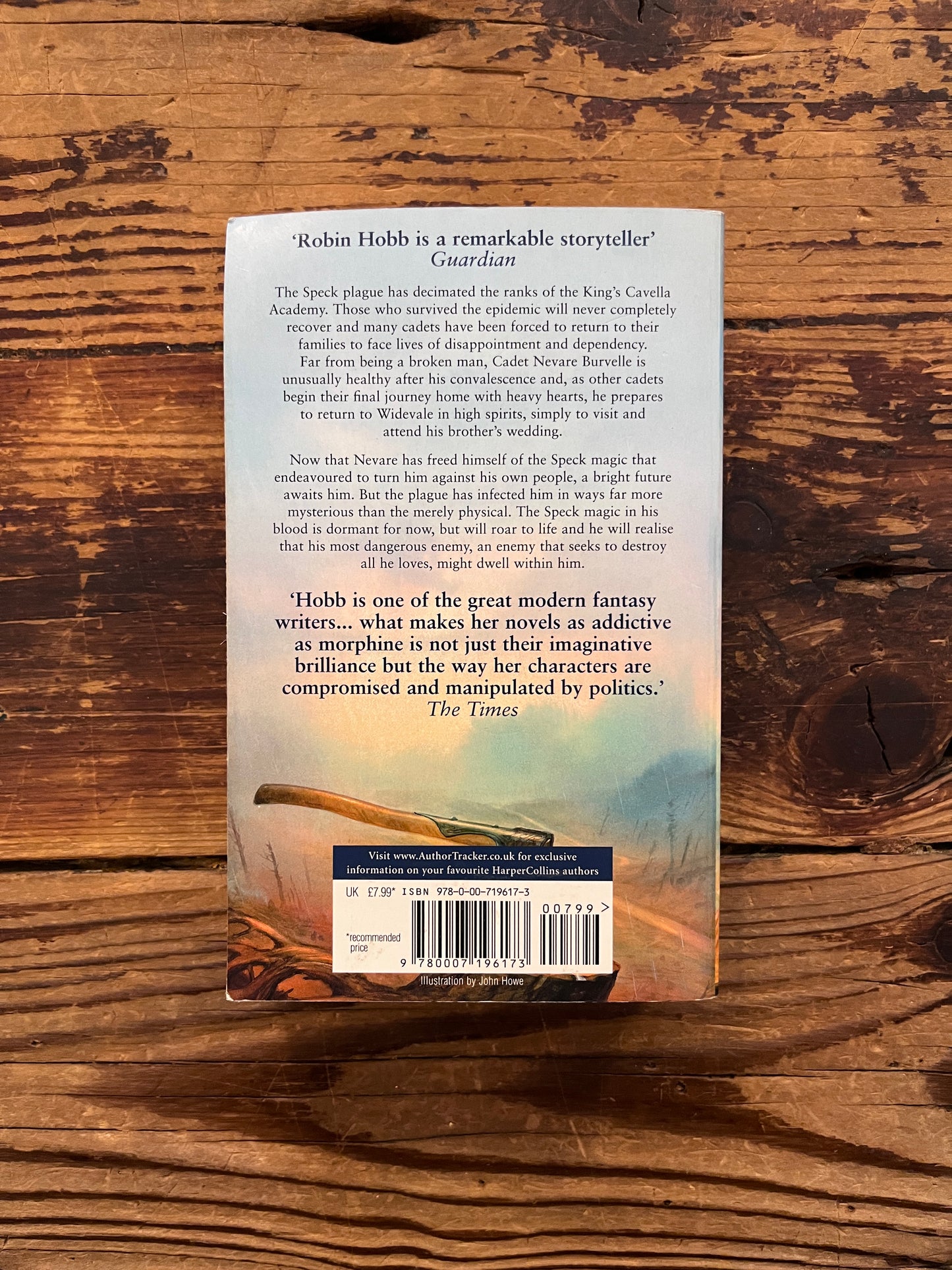 back cover of Book titled 'Forest Mage' by Robin Hobb on a wooden surface