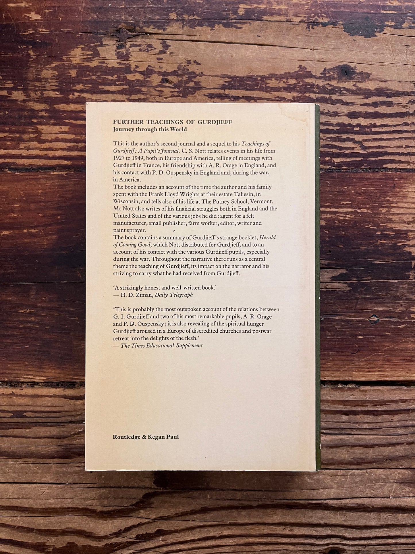 Back cover of book titled 'Further Teachings of Gurdjieff' by C.S. Nott placed on a rustic dark wood background.