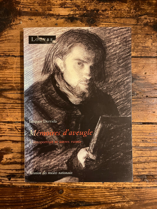 couverture du livre "mémoires d'aveugle" sur fond de bois