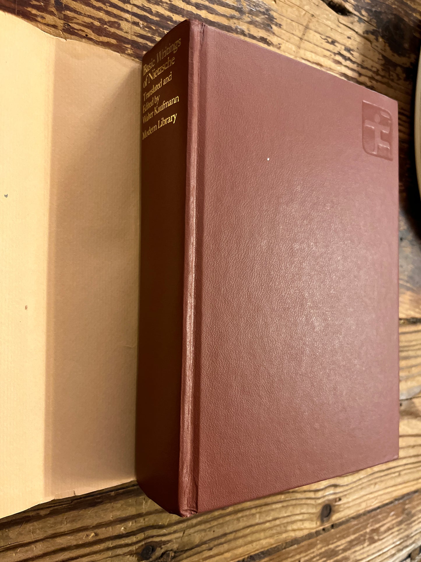 Brown leather-bound book on a wooden surface
