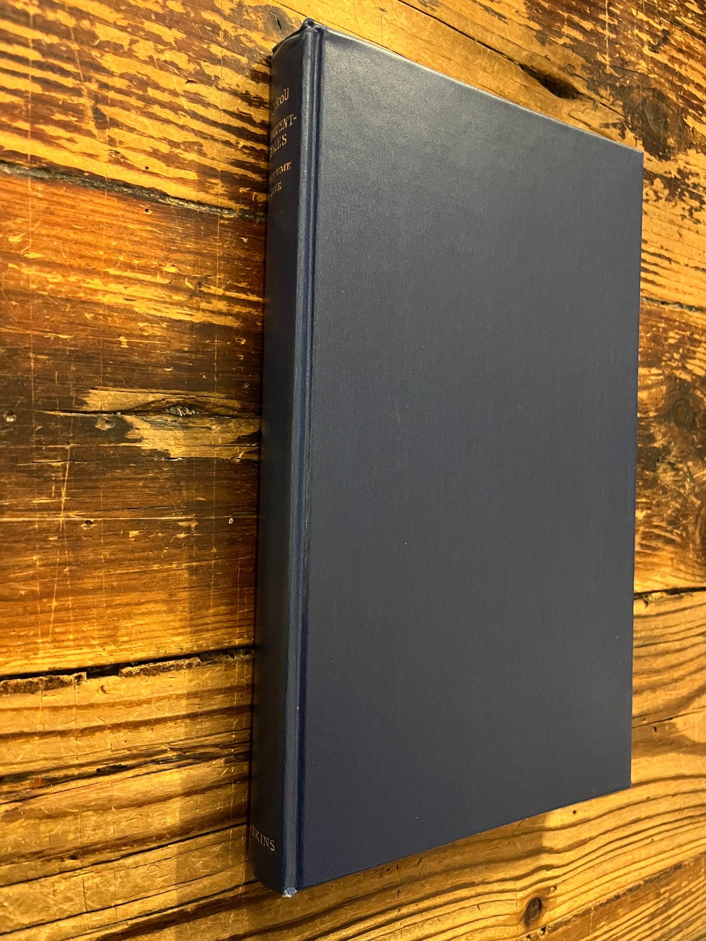 Book titled 'Psychological Commentaries on the Teaching of Gurdjieff & Ouspensky volume 5' by Maurice Nicoll on a wooden surface.