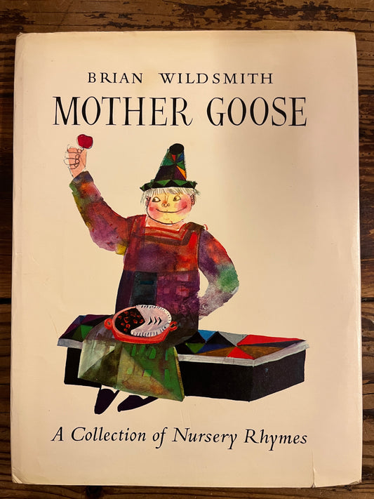 Front cover with dust-jacket of the book titled 'Mother Goose' by Brian Wild Smith on a wooden surface