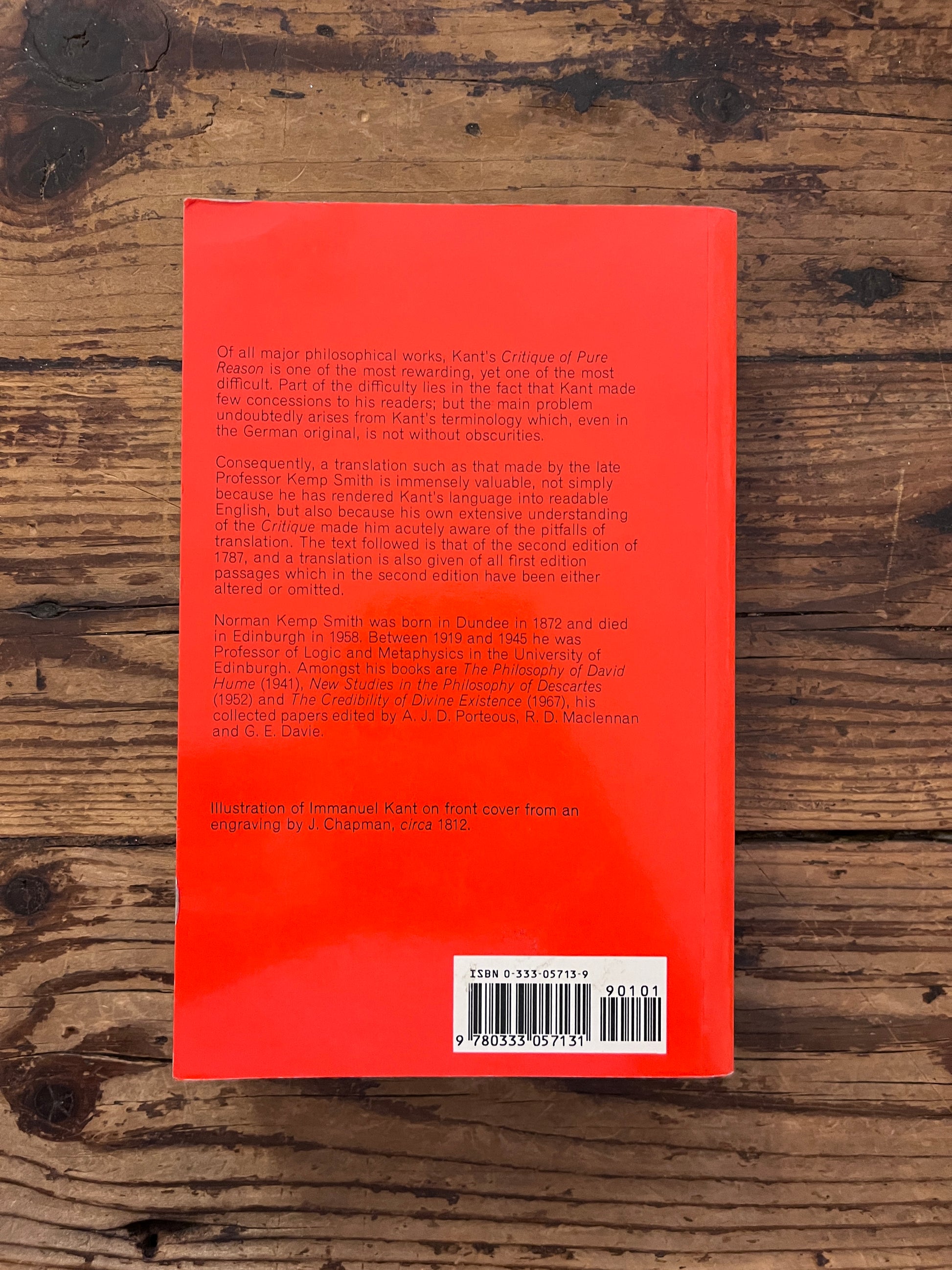 photo of the cover of the book "Immanuel's kant critique of reason" on wooden background