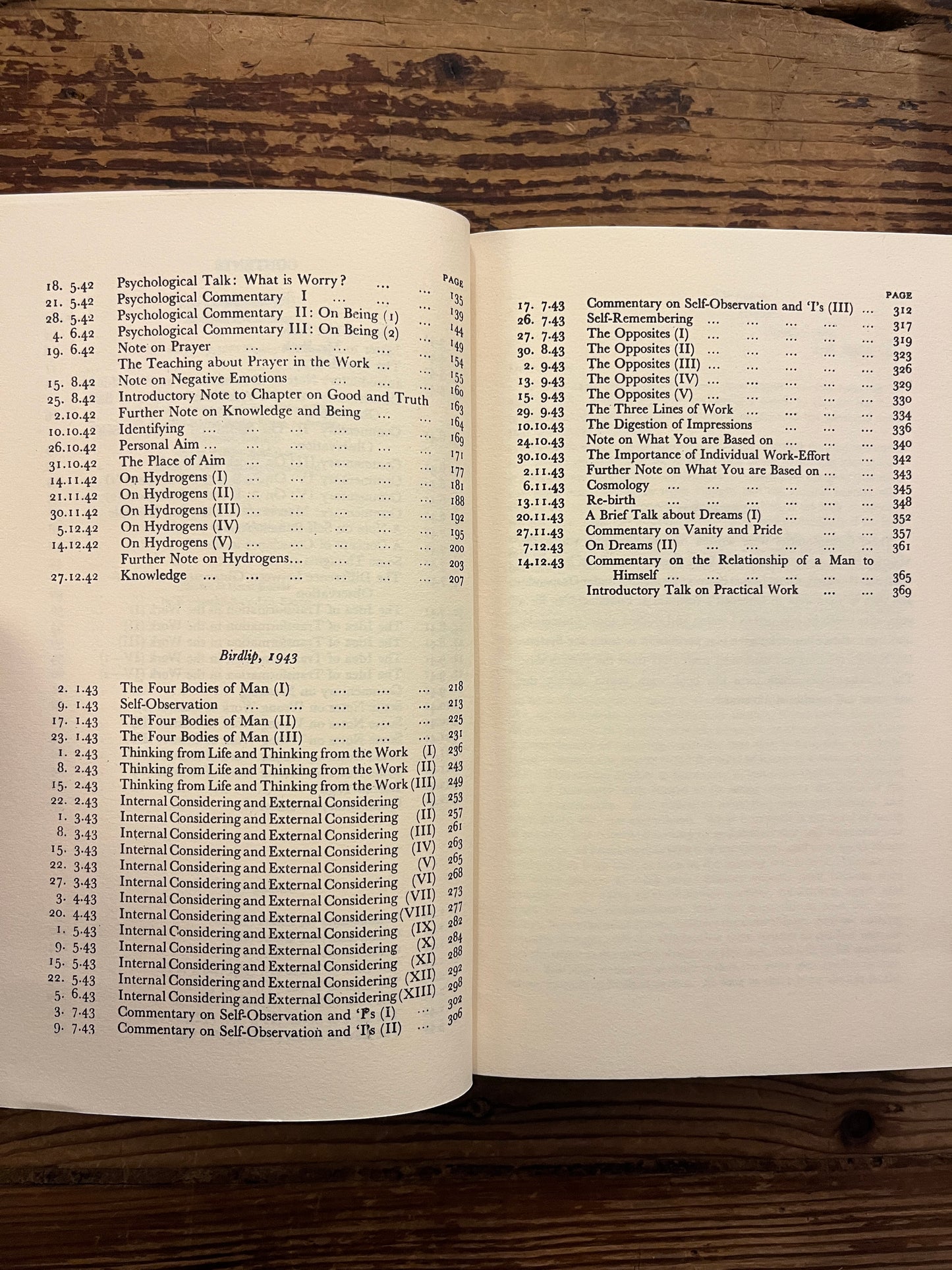 Book titled 'Psychological Commentaries on the Teaching of Gurdjieff & Ouspensky' by Maurice Nicoll on a wooden surface