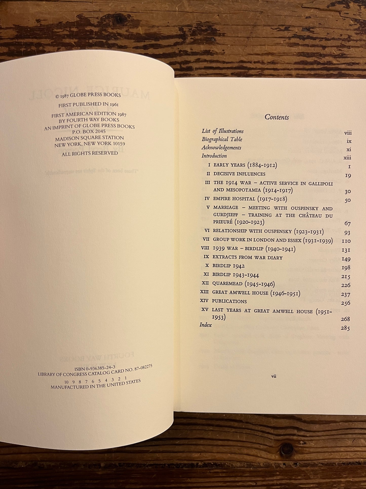 Open book showing the contents of book titled 'Maurice Nicoll: A Portrait' by Beryl Pogson on a wooden surface.