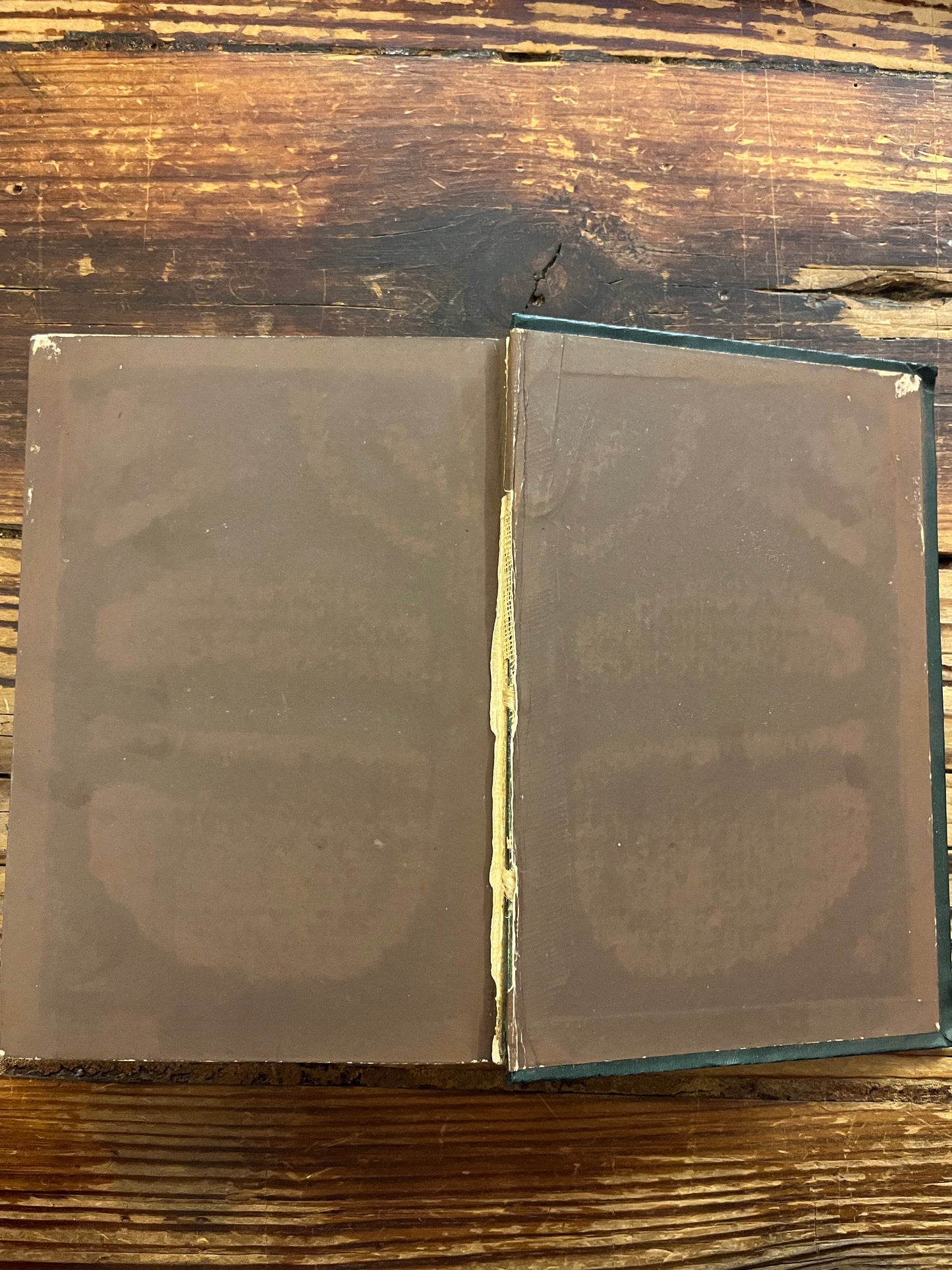 Open book titled 'Poems of the Inner Life' on a wooden surface