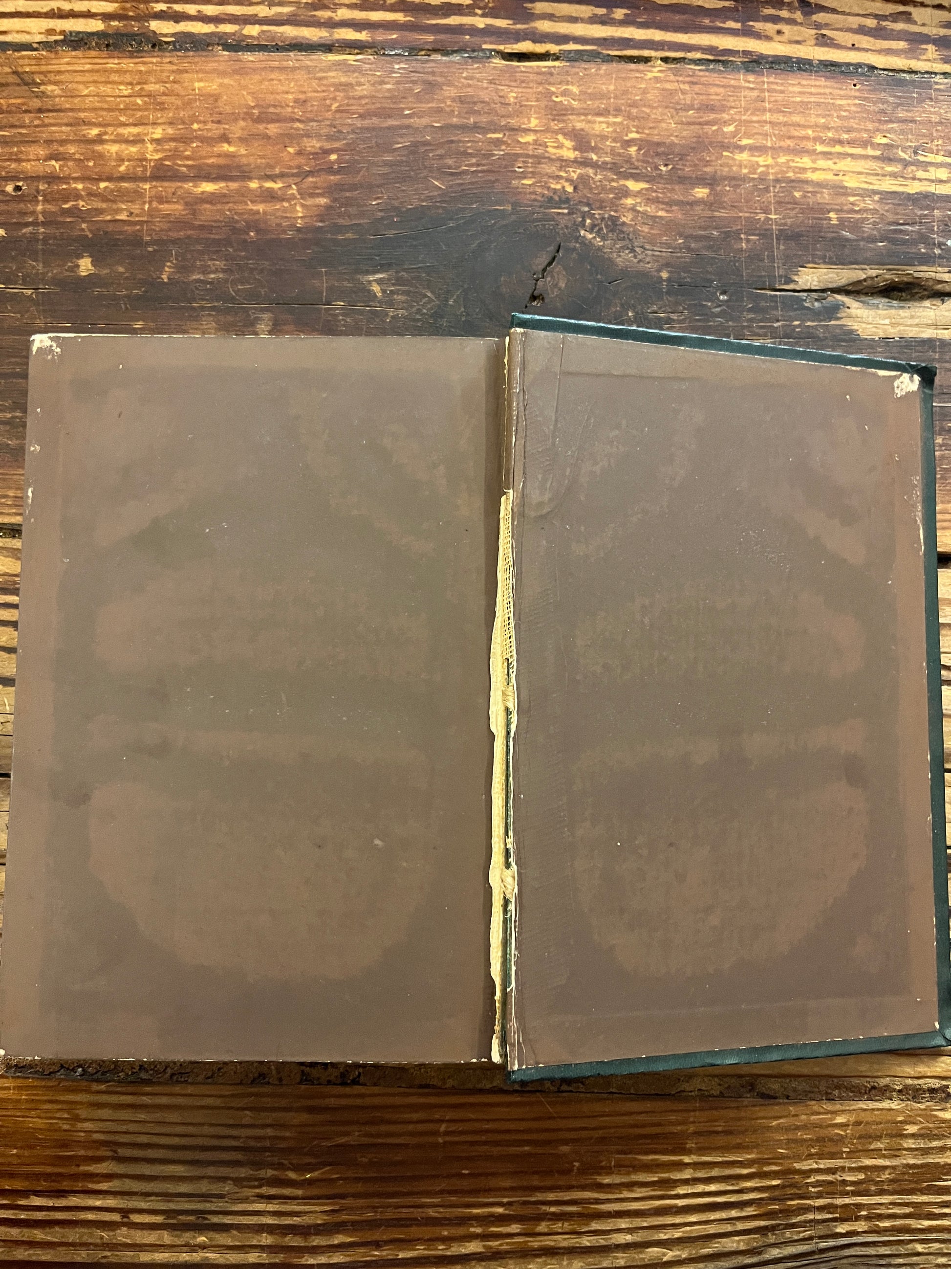 Open book titled 'Poems of the Inner Life' on a wooden surface