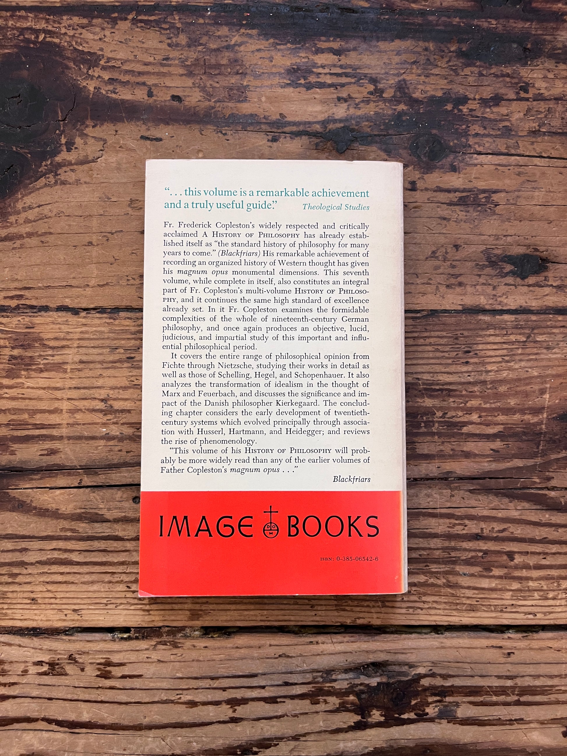 photo of the cover of the book "a history of philosophy" on a wooden background