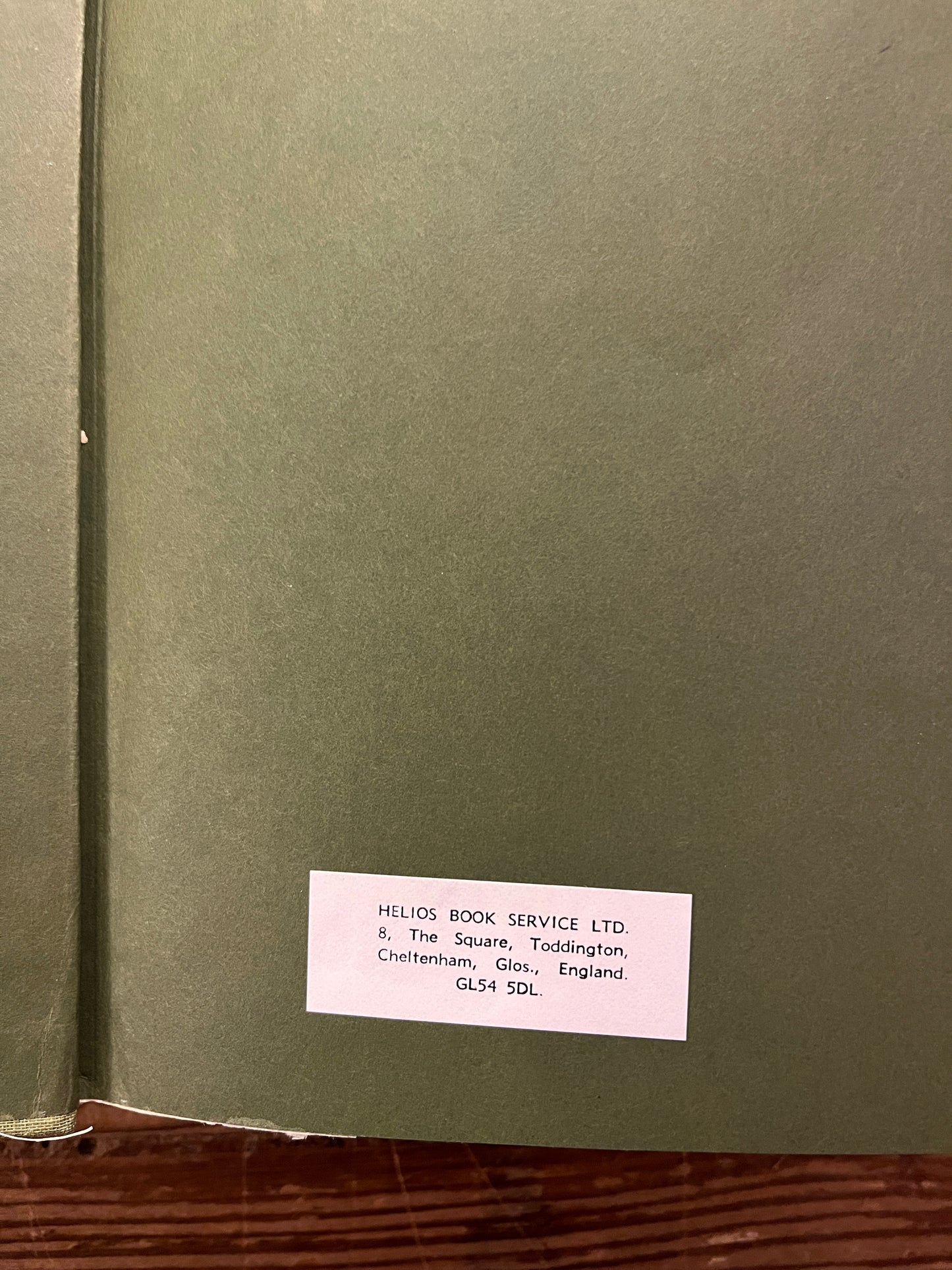 Open book titled 'The Nag Hammadi Library in English' on a wooden surface