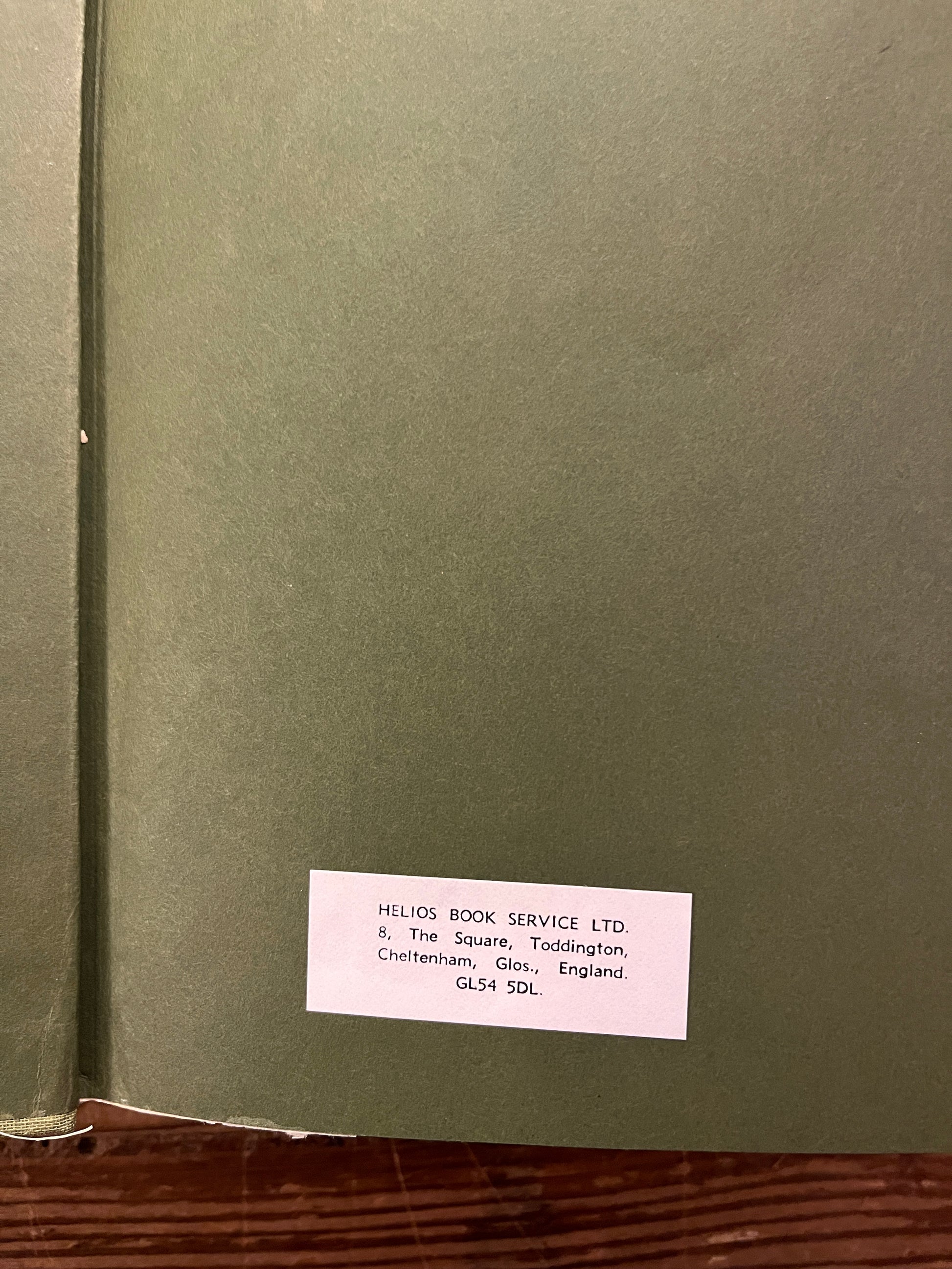 Open book titled 'The Nag Hammadi Library in English' on a wooden surface