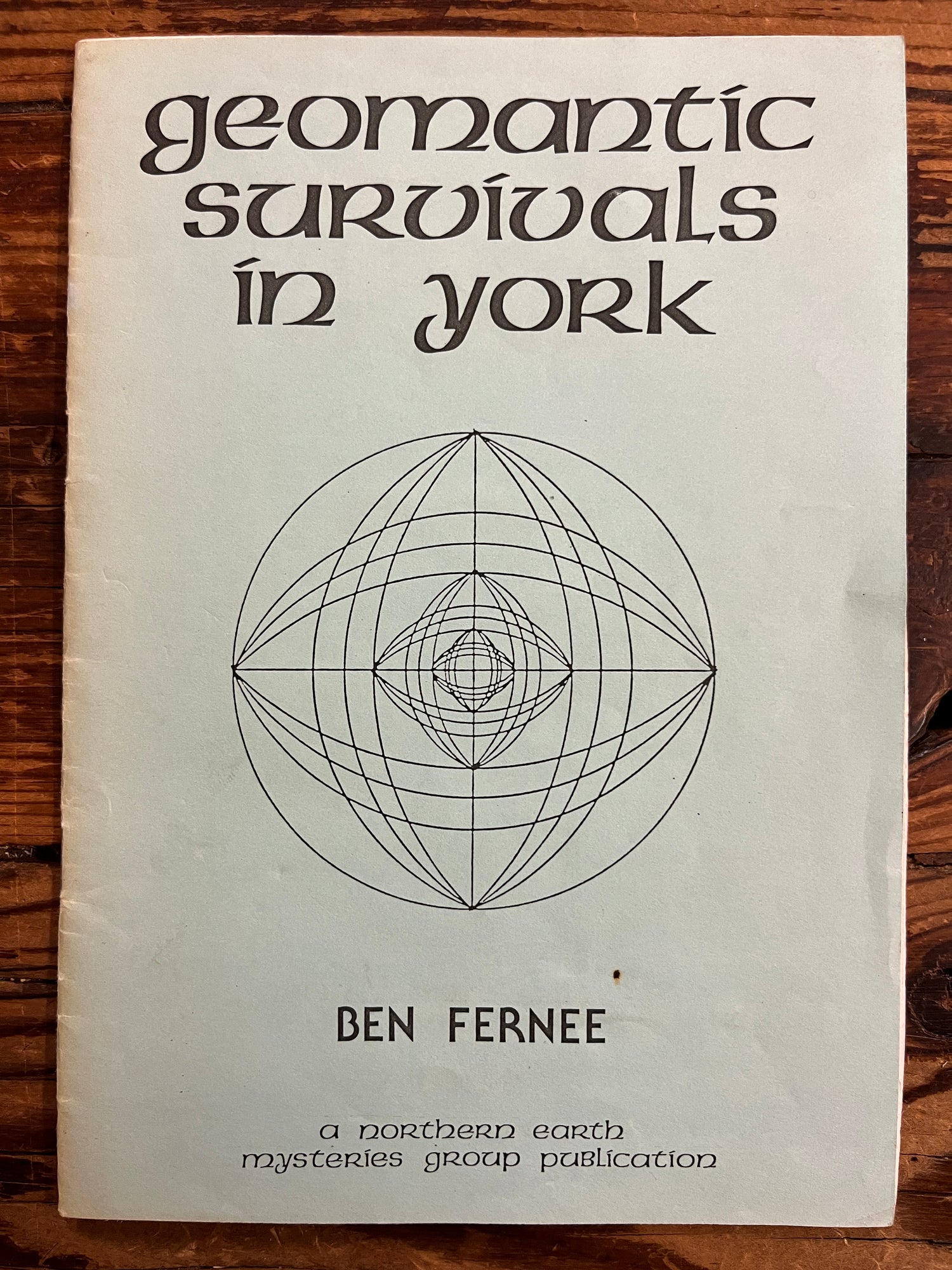 Book titled 'Geometric Survivals in York' by Ben Fernee on a wooden surface