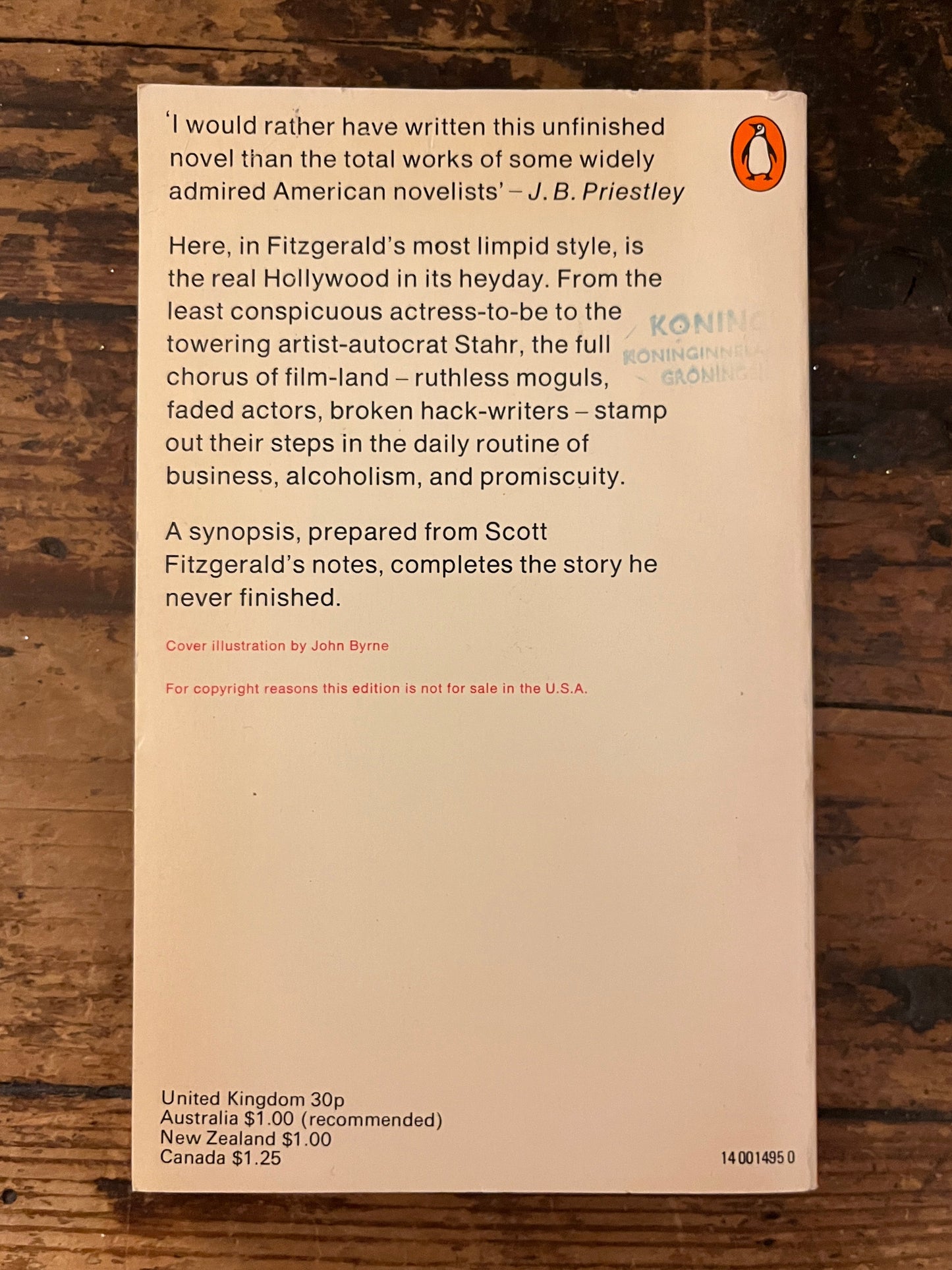 back cover of the book "The last tycoon" on a wooden background