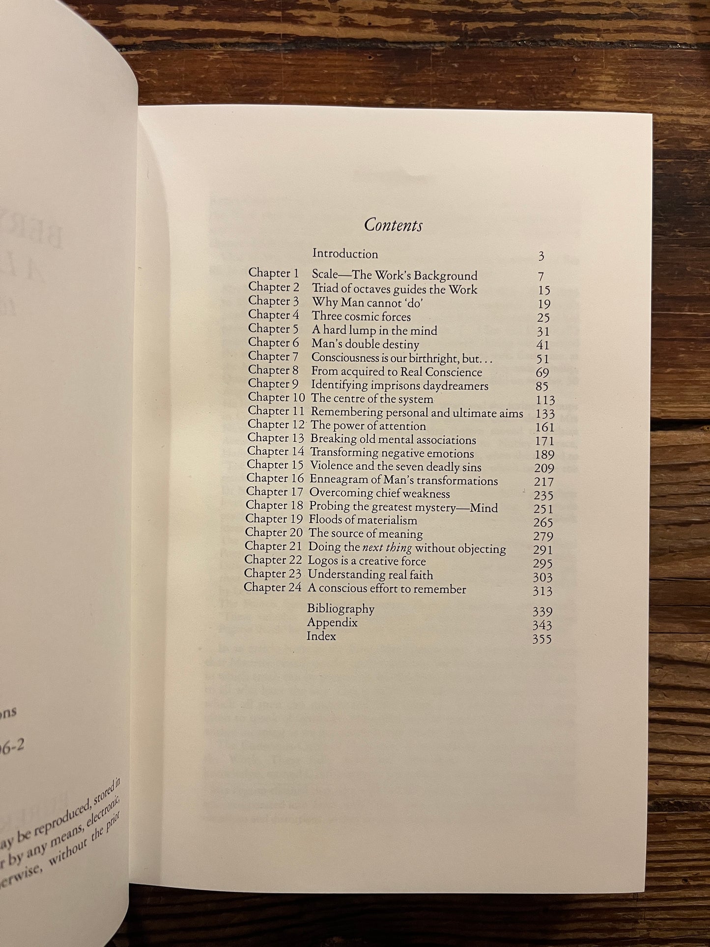 Open book titled 'Beryl Pogson: A Life Dedicated to the Work' by Bob Hunter on a wooden surface