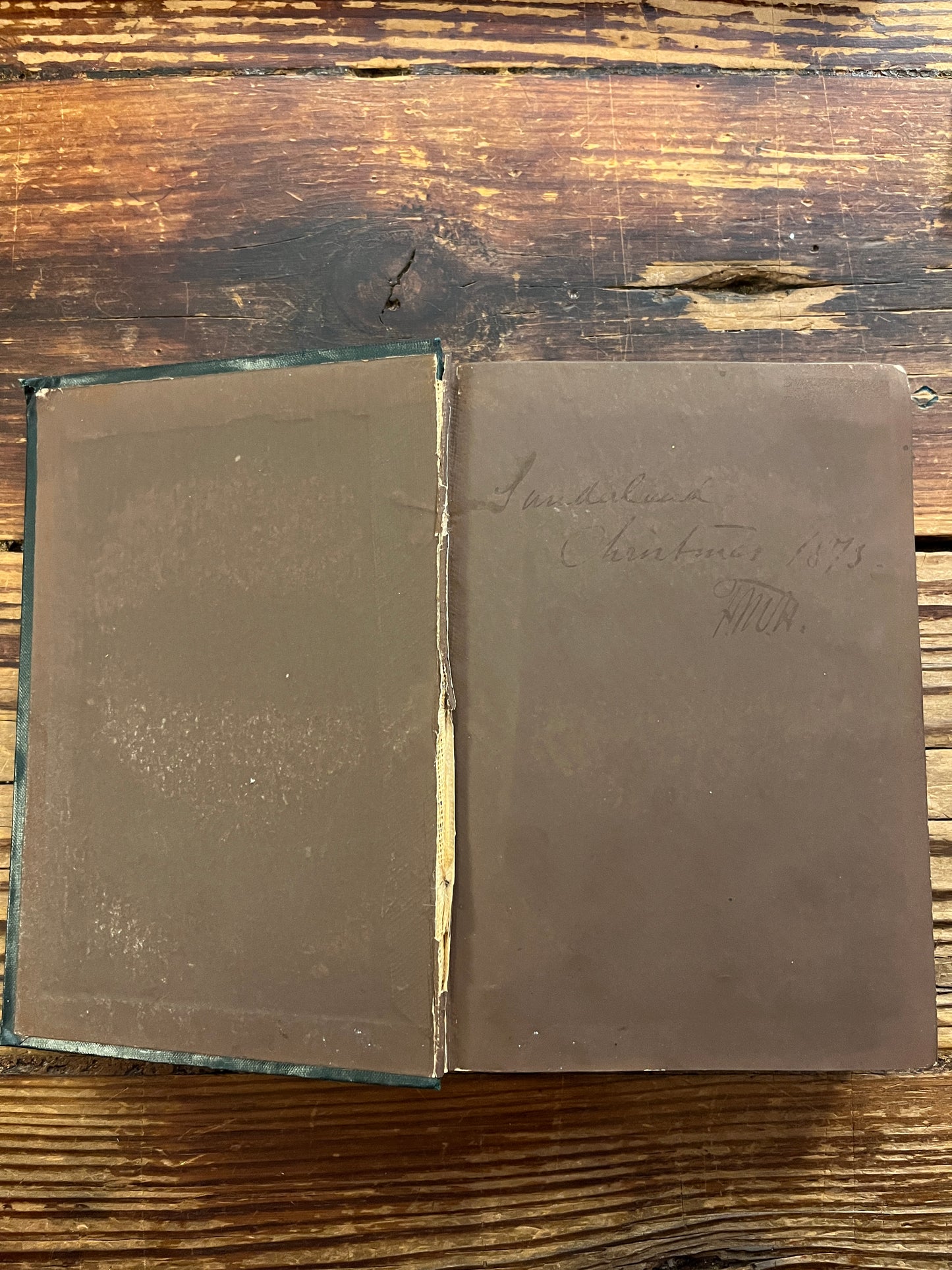 Open book titled 'Poems of the Inner Life' on a wooden surface
