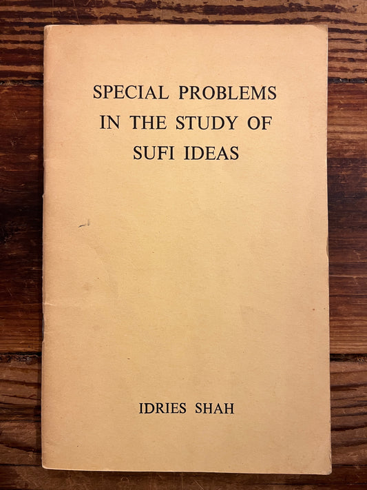 Book titled 'Special Problems in the Study of Sufi Ideas' by Idries Shah on a wooden surface