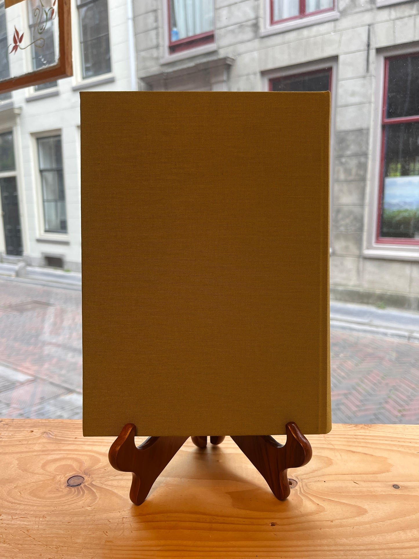 Back cover of book titled 'From Poimandres to Jacob Böhme: Gnosis, Hermetism, and the Christian tradition Edited by Roelof van den Broek and Cis van Heertum' in front of a window 