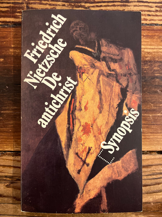 Book cover with text and artistic design on a wooden surface