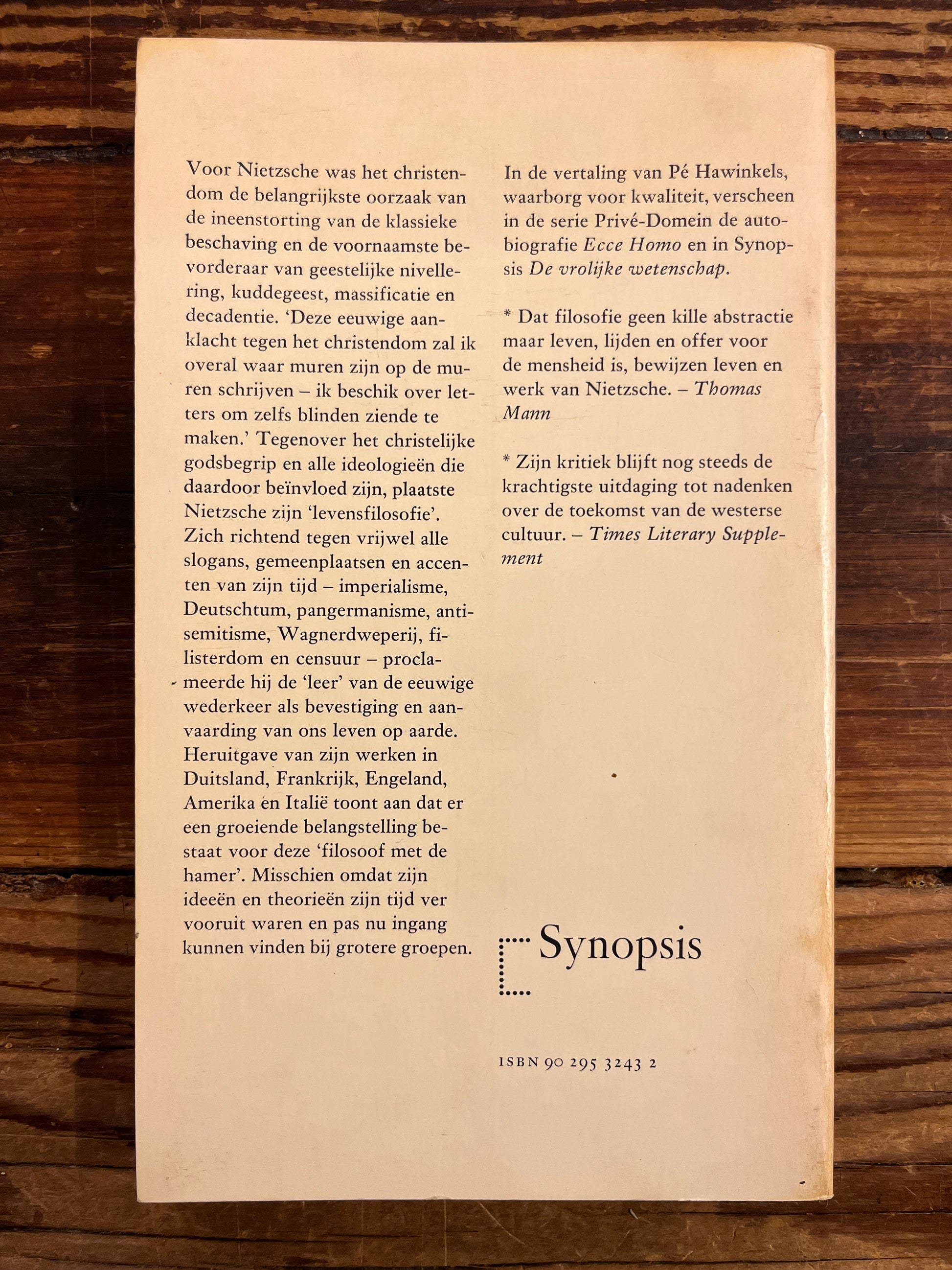back of book with text on a wooden surface