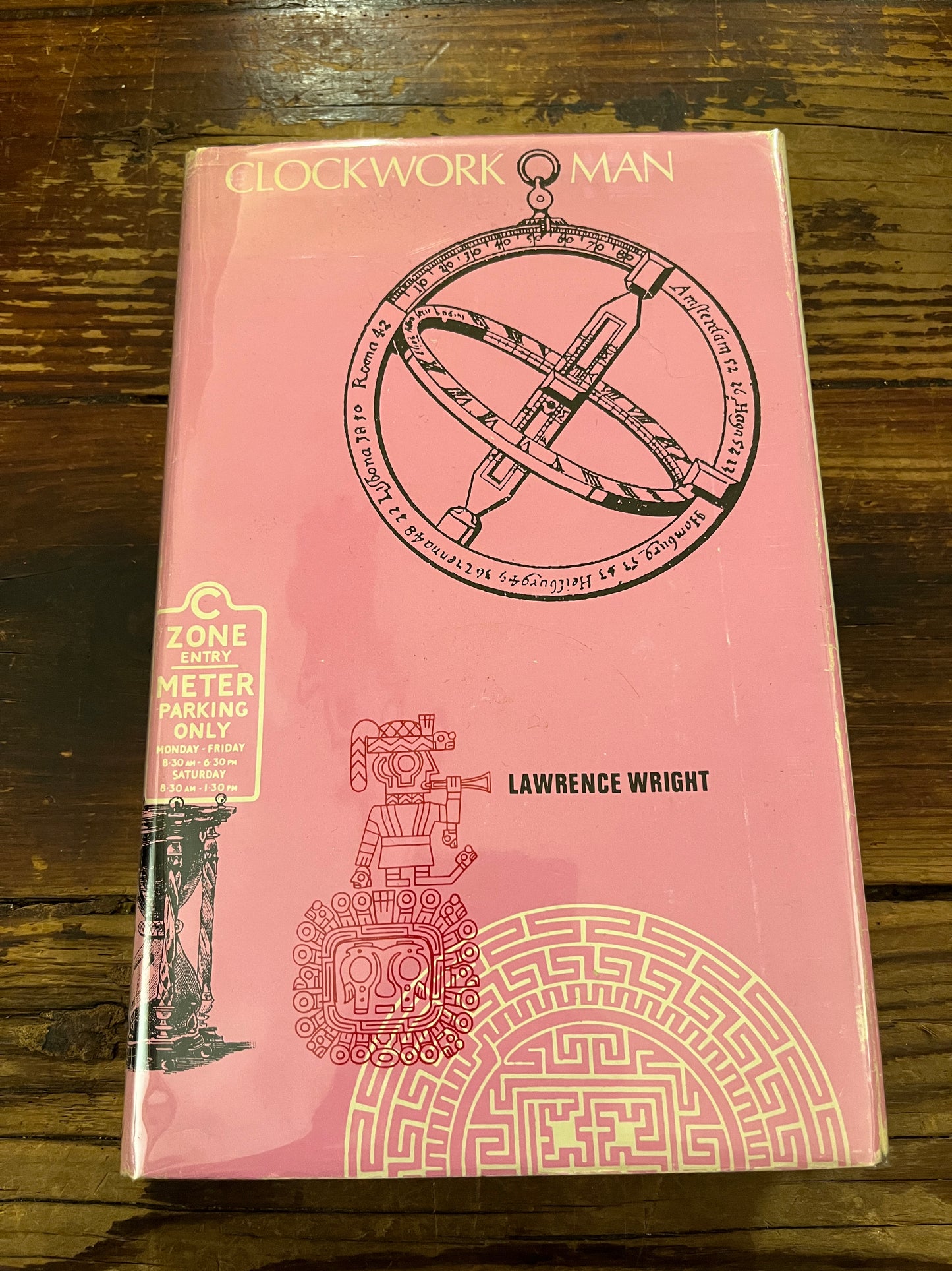 Book 'clockwork man' by Lawrence Wright  on a wooden surface 