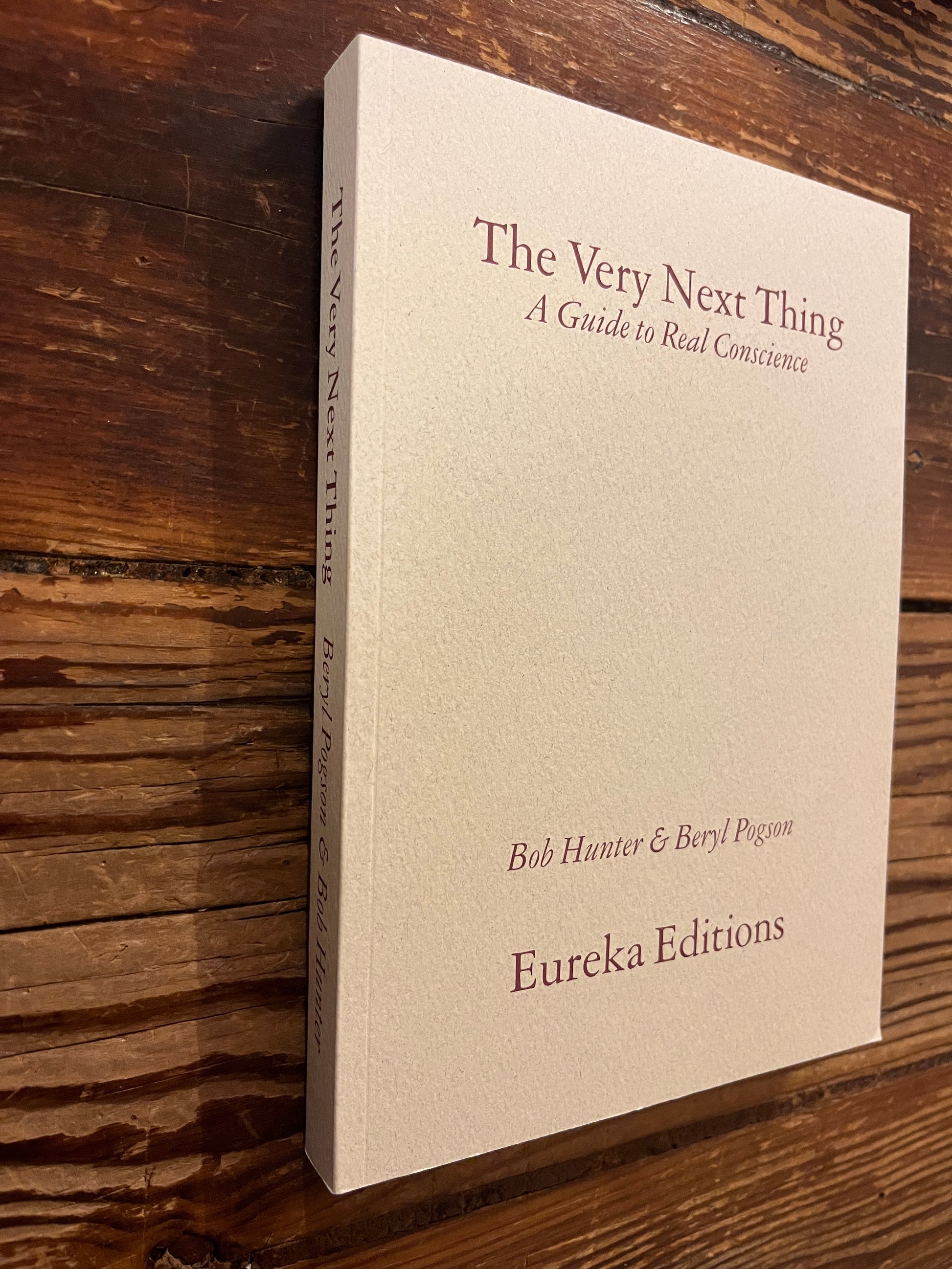  book 'The Very Next Thing' by Bob Hunter and Beryl Pogson on a wooden surface 