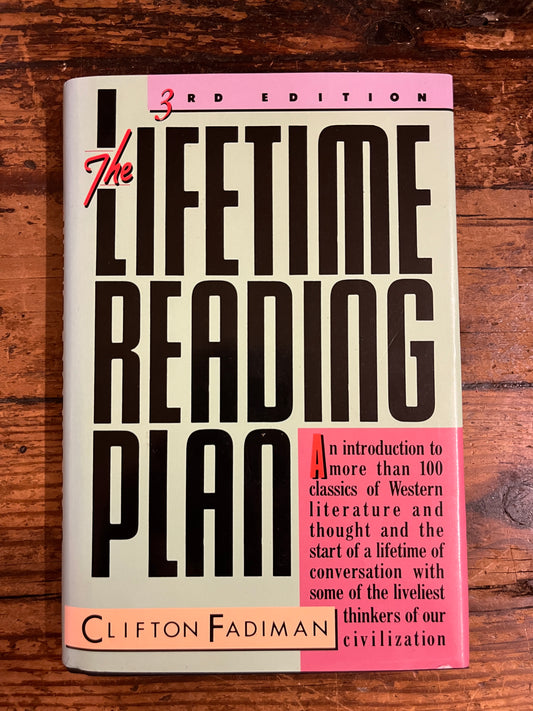 cover of the book "The lifetime reading plan" on a wooden background