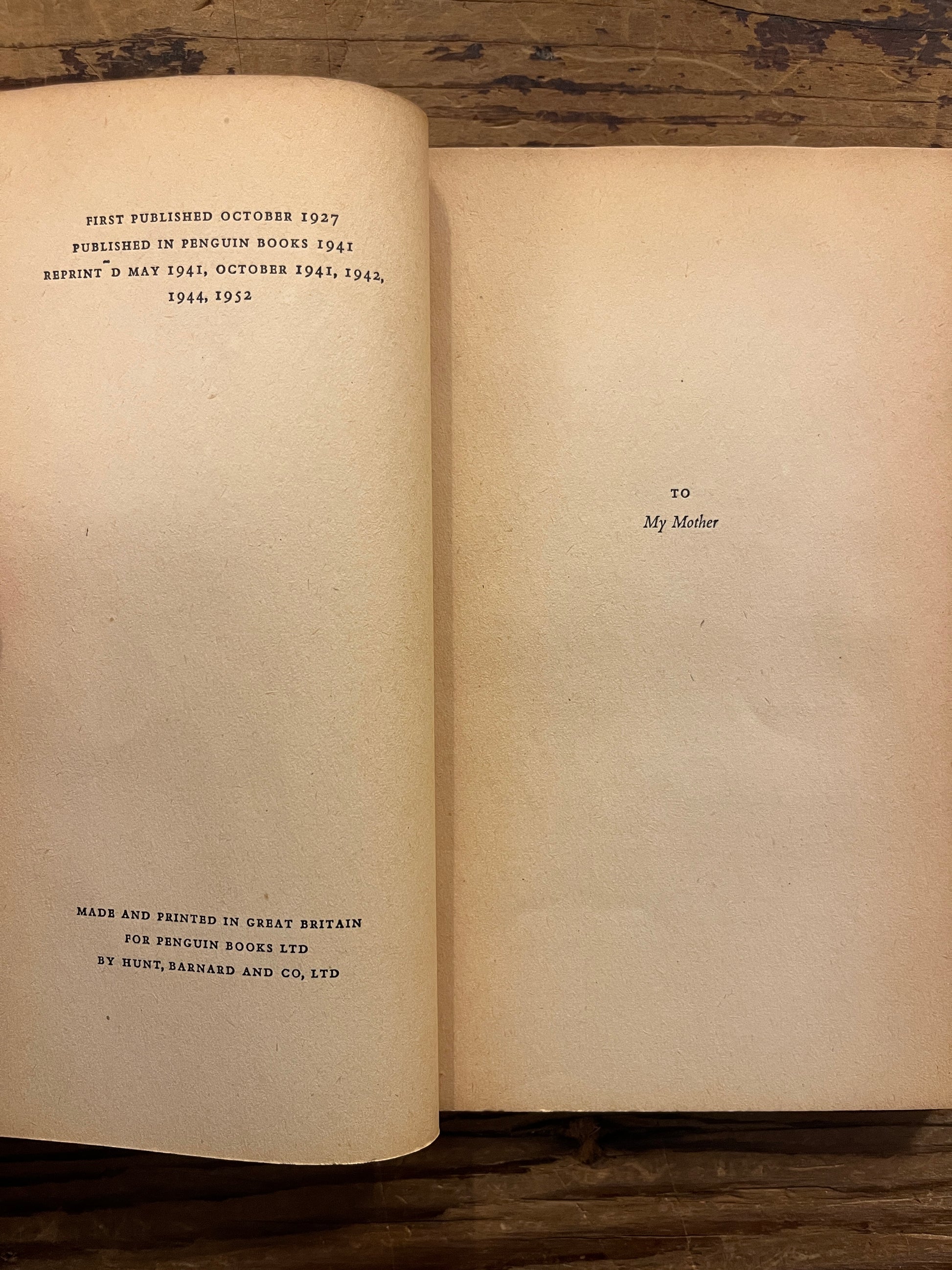 Open book titled 'The Bridge of San Luis Rey' by Thornton Wilder on a wooden surface