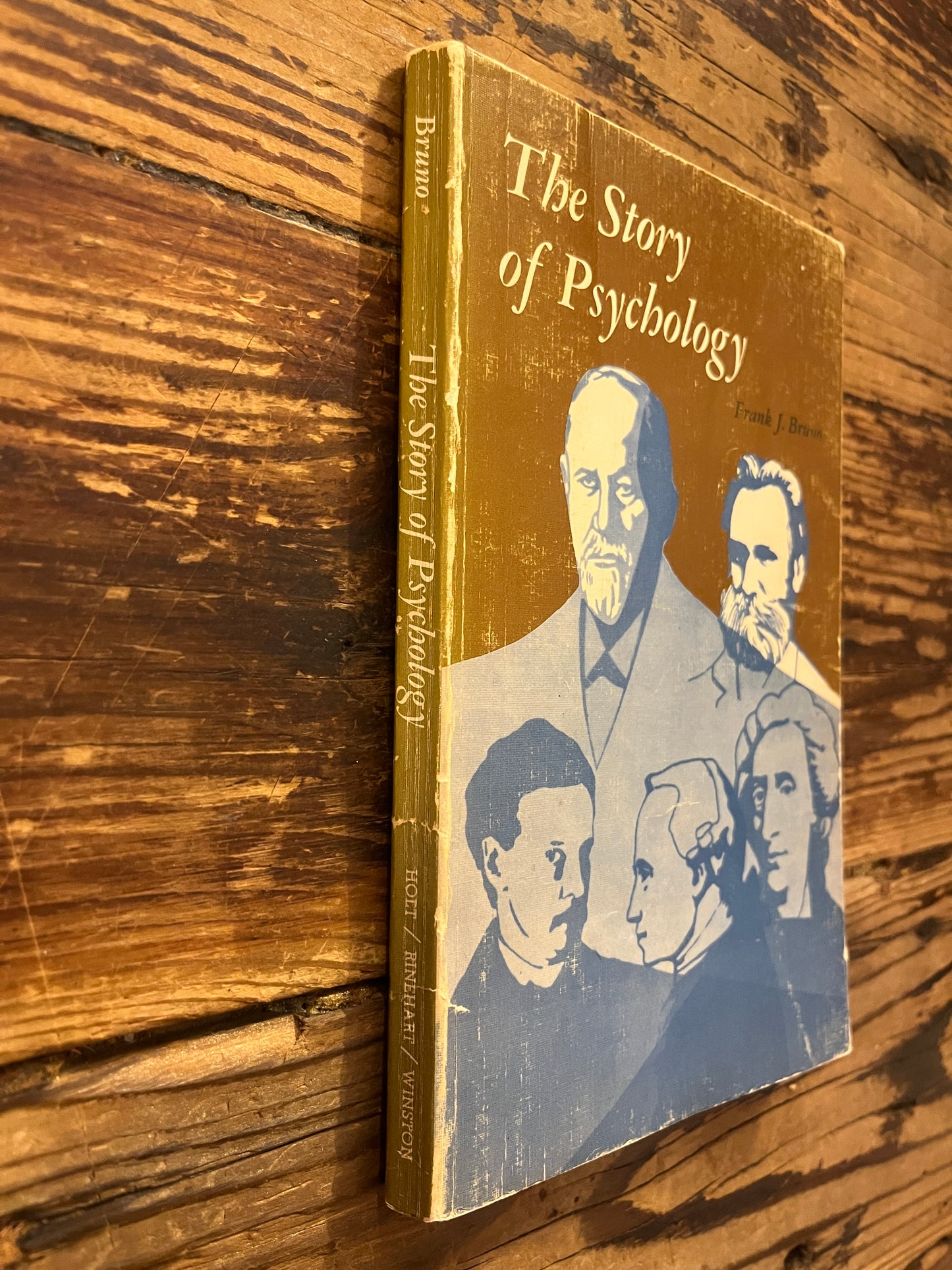 Book titled 'the story of psychology'  by Frank J. Bruno on a wooden surface 