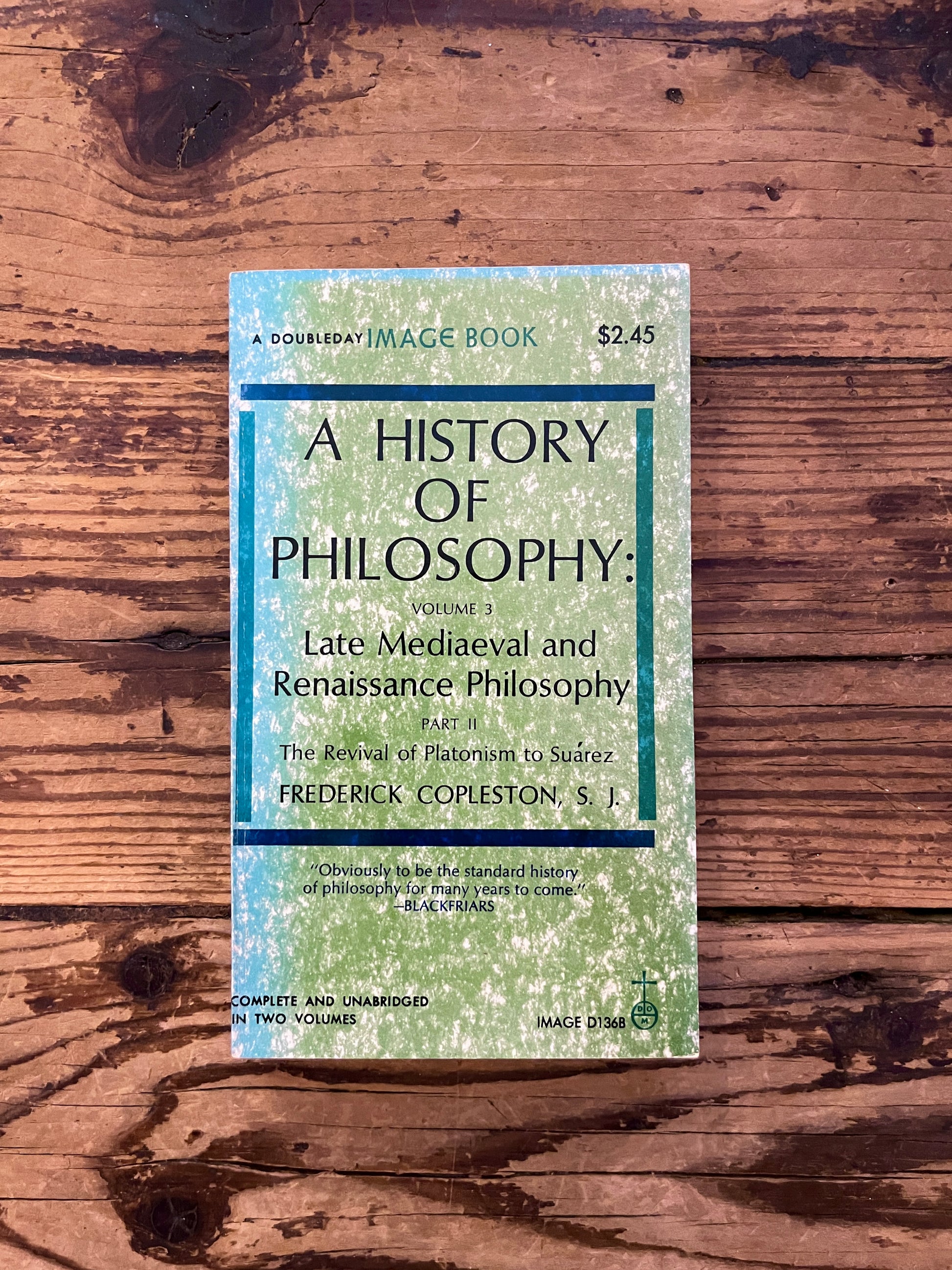 photo of the cover of the book "a history of philosophy" on a wooden background