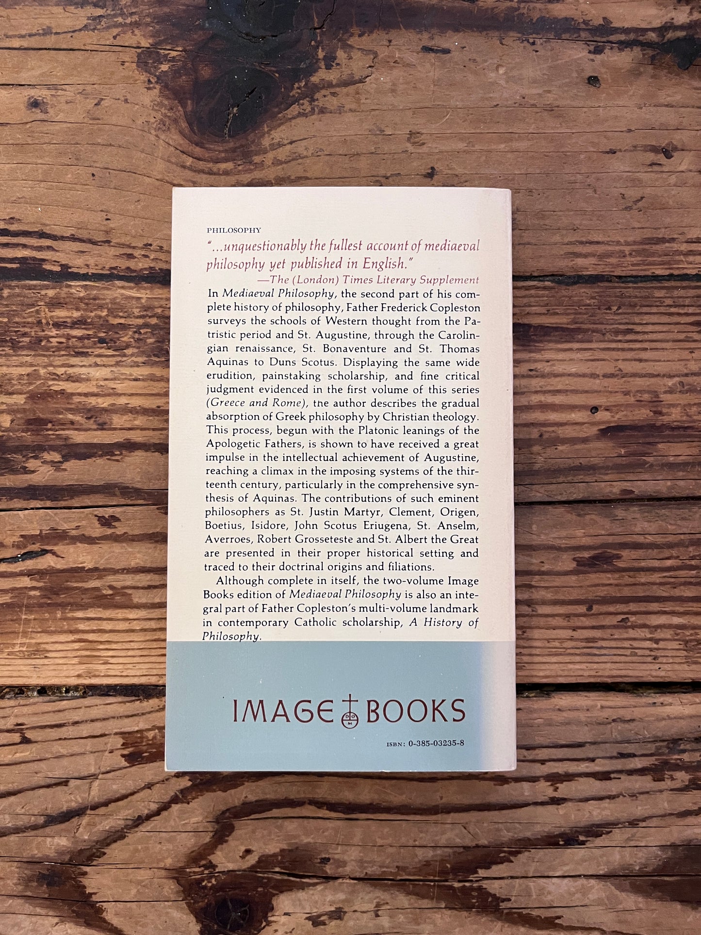 photo of the cover of the book"a history of philosophy" on a wooden background