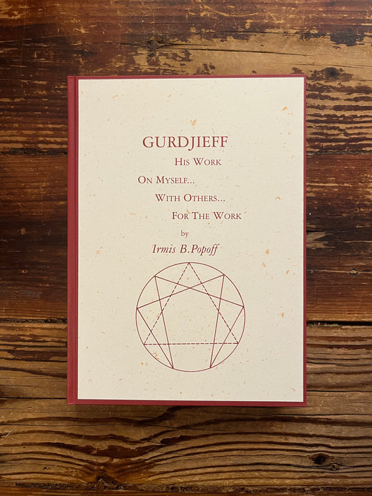 Front cover of book with the title 'Gurdjieff, His work, on myself, with others, for the work' by Irmis B. Popoff on a wooden surface 