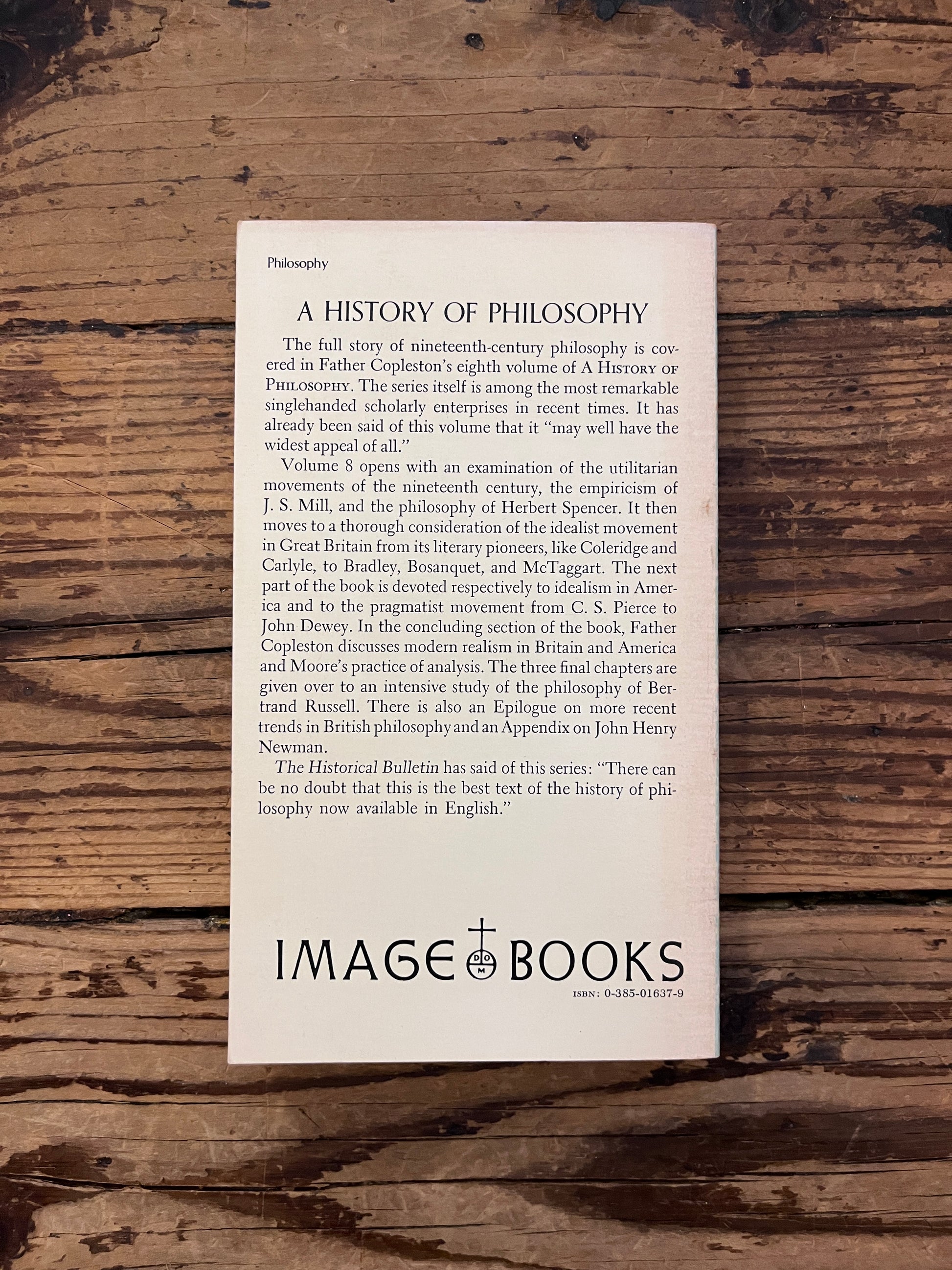 photo of the cover of the book "a history of philosophy" on a wooden background