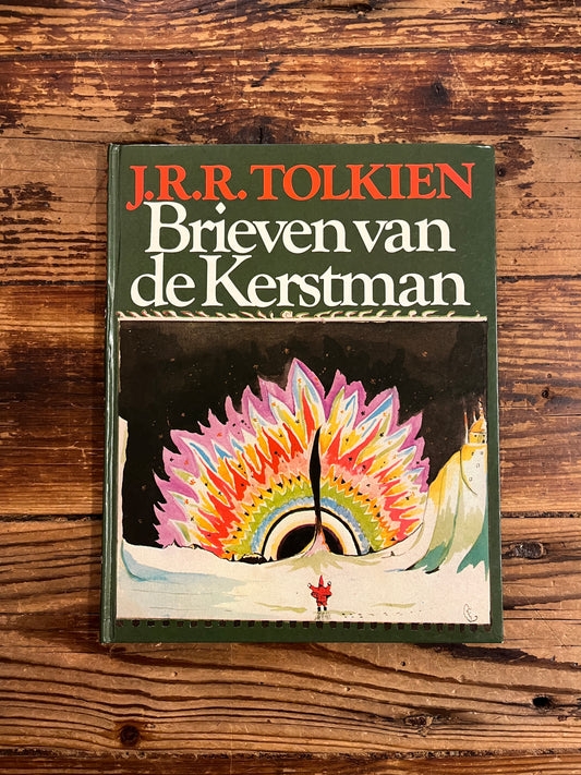 Voorkant van boek 'brieven van de kerstman' door J. R. R. Tolkien op een houten achtergrond 