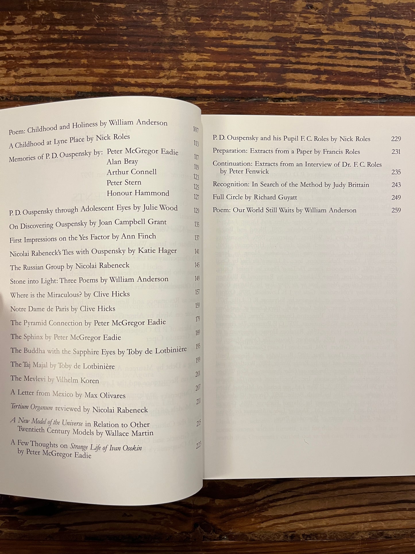 Open book titled 'The Bridge n.12 P.D. Ouspensky  commemorative issue' on a wooden surface