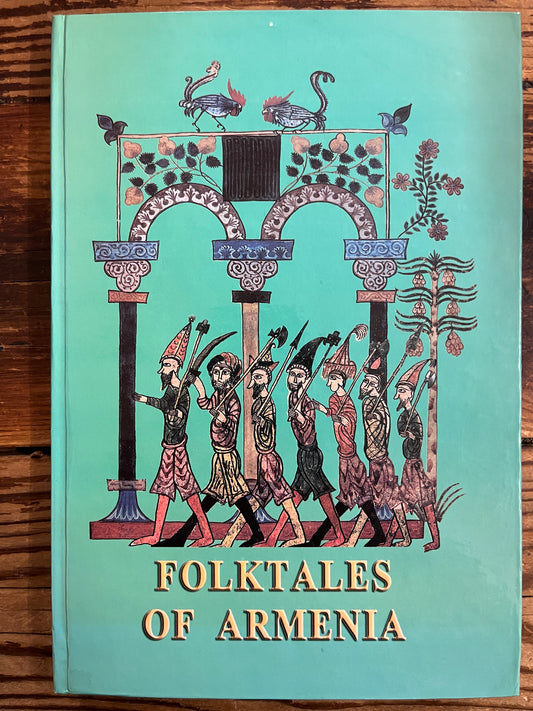 Front cover of book titled 'Folktales of Armenia' with decorative cover on a wooden surface