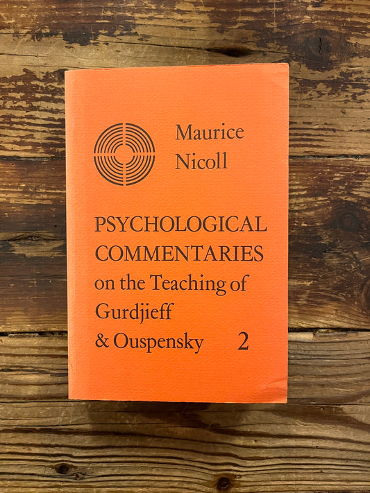 Book titled 'Psychological Commentaries on the Teaching of Gurdjieff & Ouspensky volume 2' by Maurice Nicoll on a wooden surface