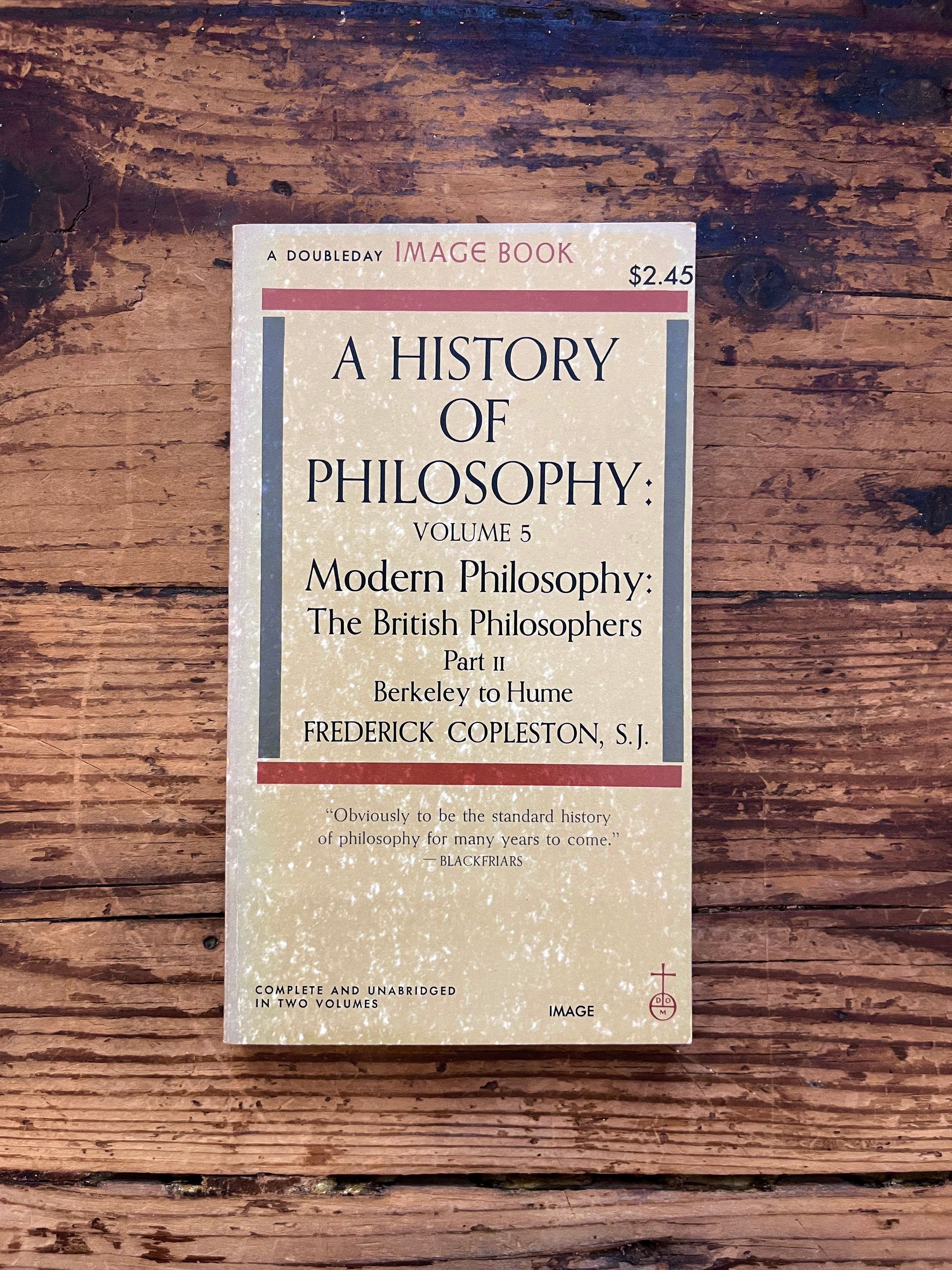 photo of the cover of the book "a history of philosophy" on a wooden background