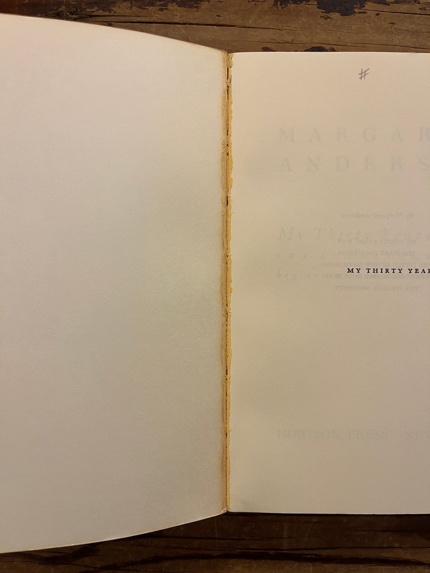 open book with the title 'My Thirty Years' War' by Margaret Anderson on a wooden surface