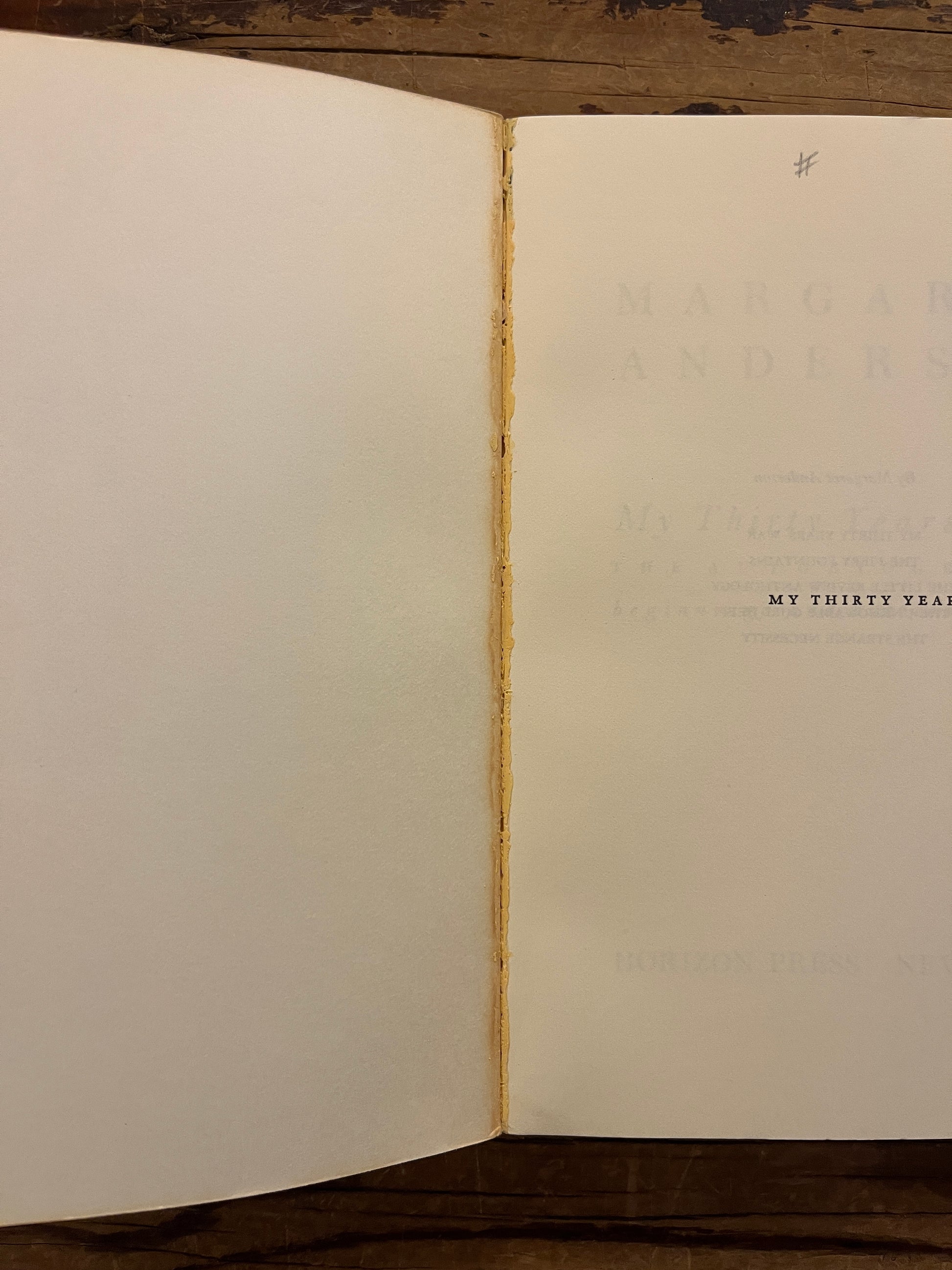 open book with the title 'My Thirty Years' War' by Margaret Anderson on a wooden surface