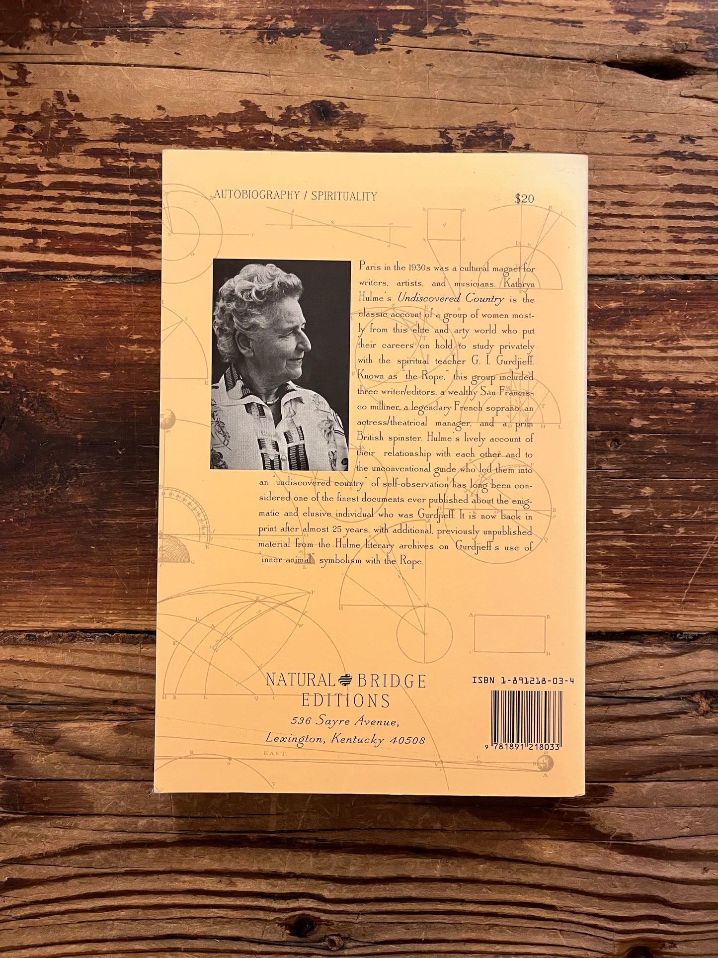 Book titled 'Undiscovered Country: The Search for Gurdjieff' by Kathryn Hulme on a wooden surface