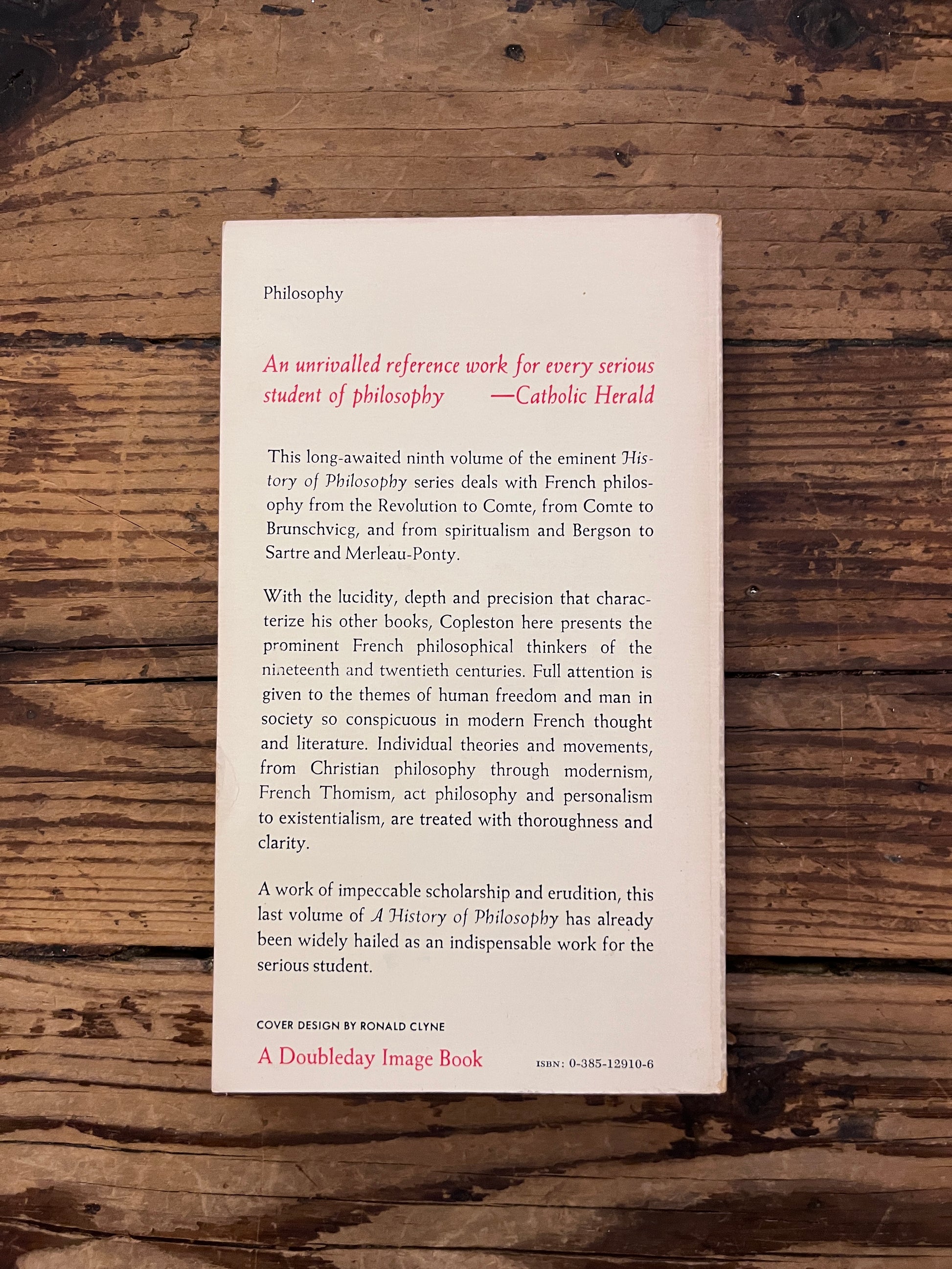 photo of the cover of the book " a history of philosophy" on a wooden background