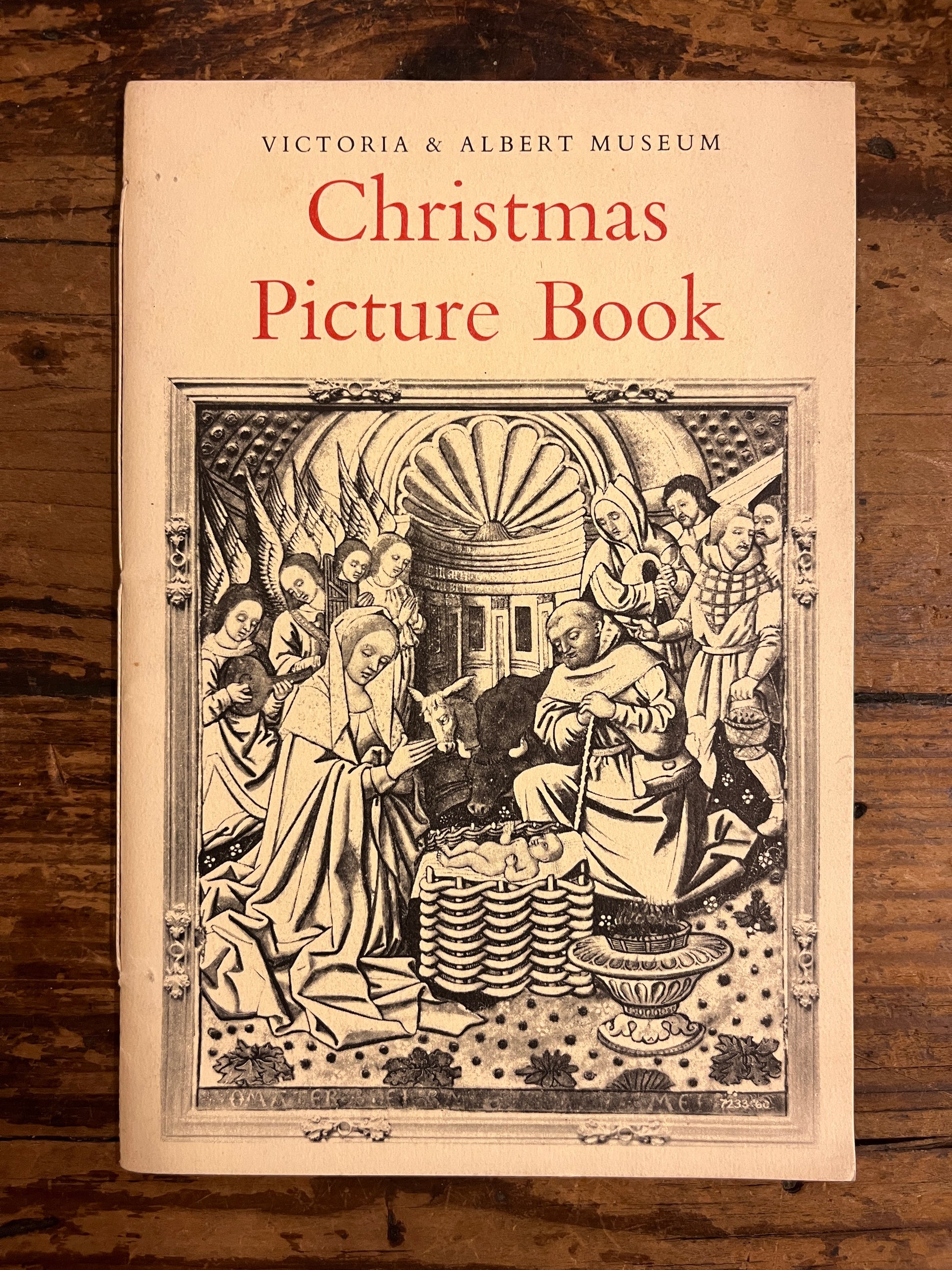 front cover of the booklet "Christmas picture book" on a wooden background