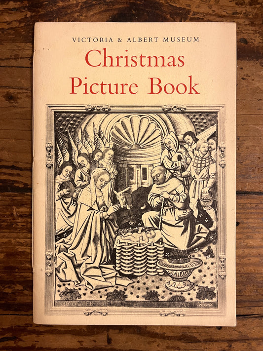 front cover of the booklet "Christmas picture book" on a wooden background