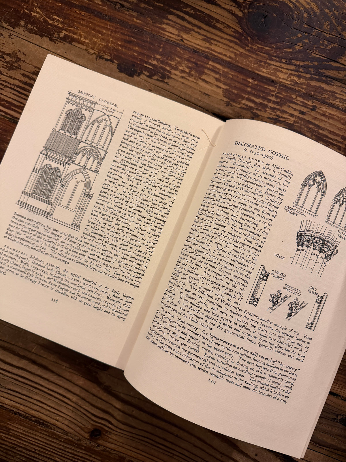 Open book titled 'Cathedrals' from 1926 from the series made by 'The Great Western Railway' on a wooden surface