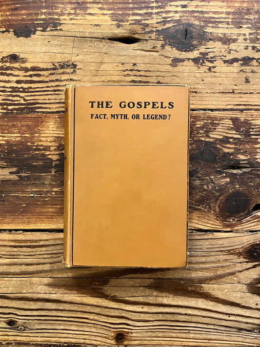Front cover of book with the title 'the gospels, fact, myth or legend ? by J.P. Arendzen Ph.D. on a wooden surface