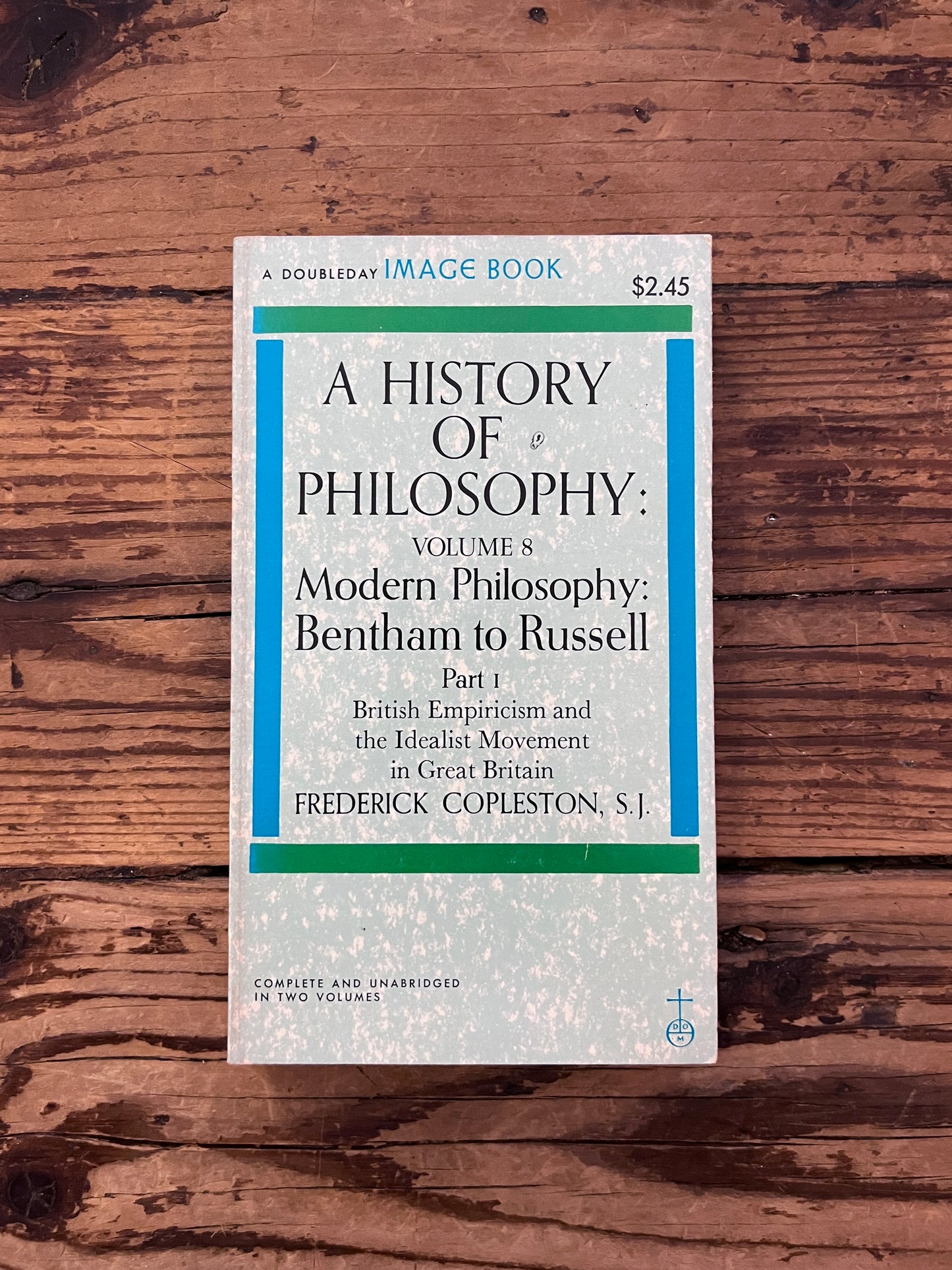 photo of the cover of the book " a history of philosophy" on a wooden background