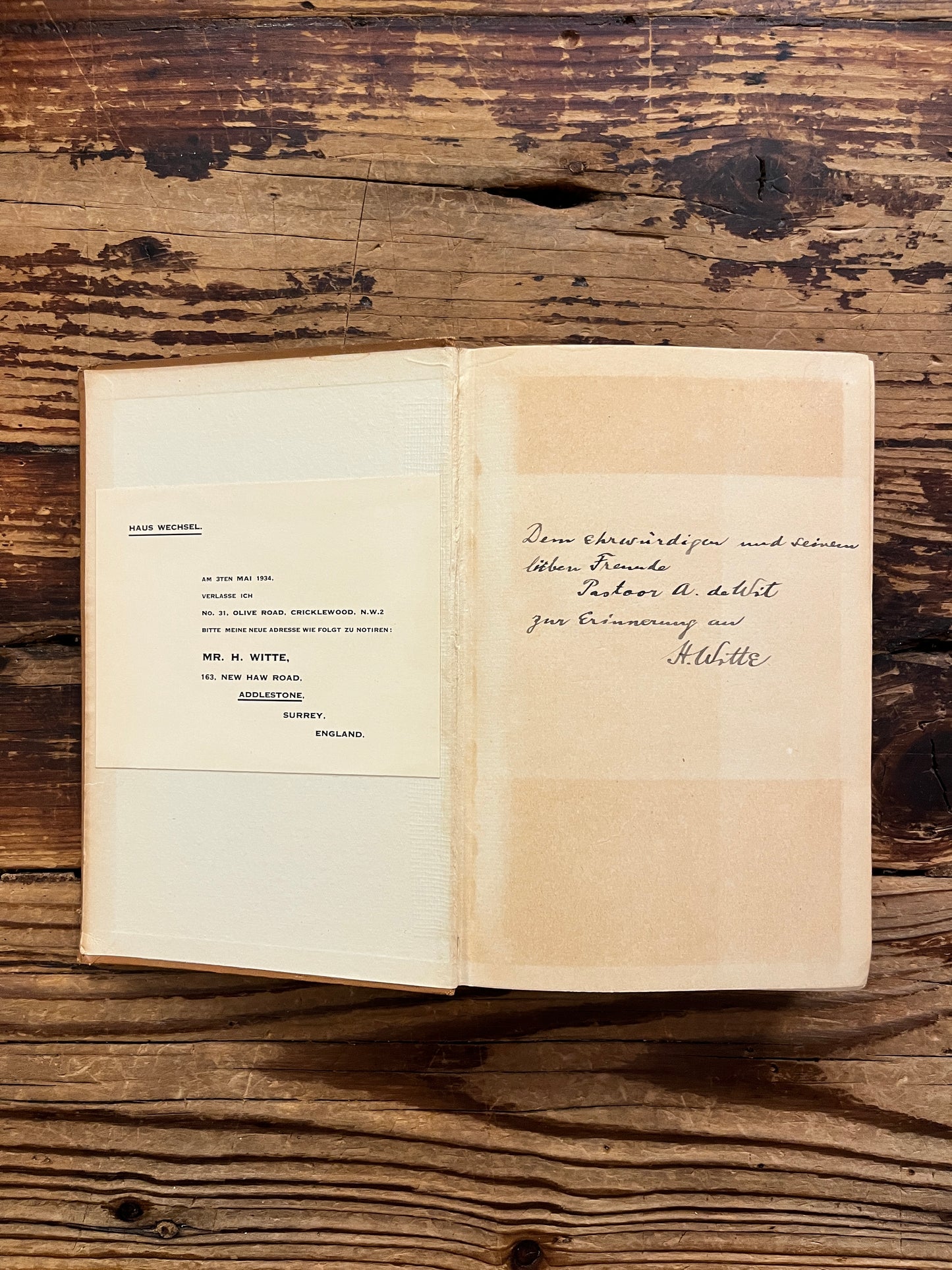 Open book with the title 'the gospels, fact, myth or legend ? by J.P. Arendzen Ph.D. on a wooden surface