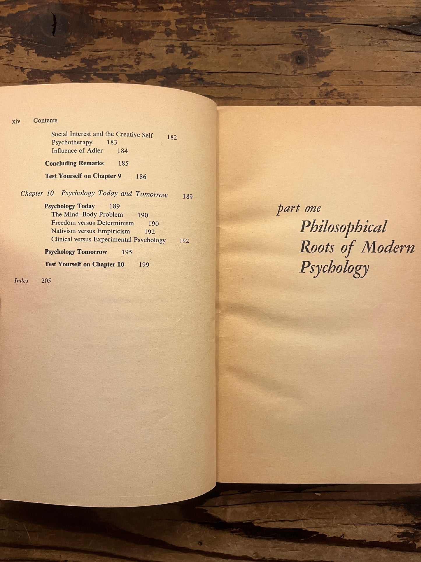 Open book titled 'the story of psychology'  by Frank J. Bruno on a wooden surface 