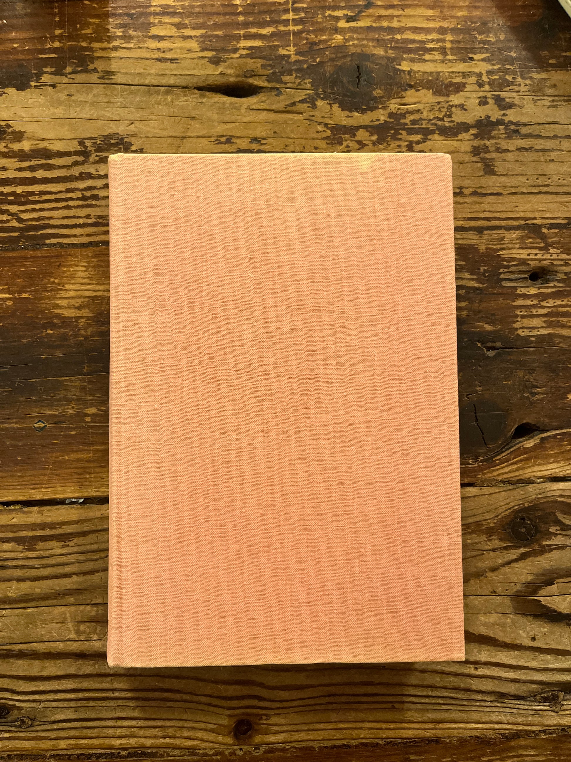 Book titled 'A History of Six Ideas' by Wladyslaw Tatarkiewicz on a wooden surface 